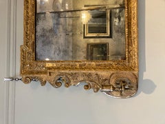 A fine early 18th C triple-plate George II carved giltwood framed overmantle