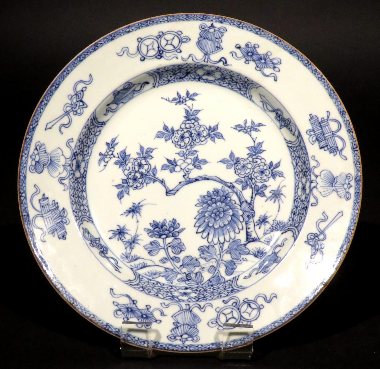 The central field decorated with flowering lotus branches & peony flowerheads, rising to a shoulder with a repeating band of geometric leafy designs interspersed by panels with auspicious designs, the lip with auspicious & scholarly symbols