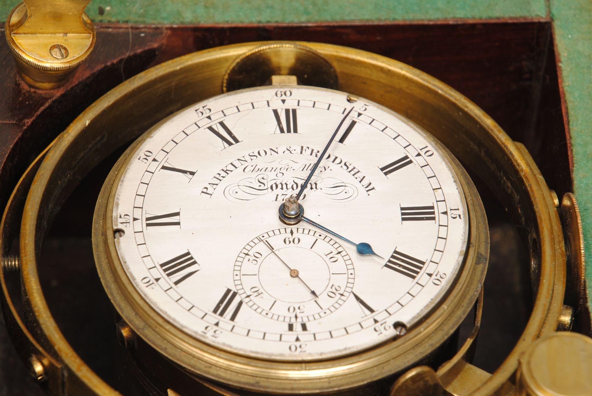 An early 19th century 2 day marine chronometer by Parkinson and Frodsham, London. Numbered on the brass bound mahogany 3 tier box, and the dial 1769. Beautifully signed on the movement and the silvered dial, and with a sprung dust cover. Dial is 8cm
