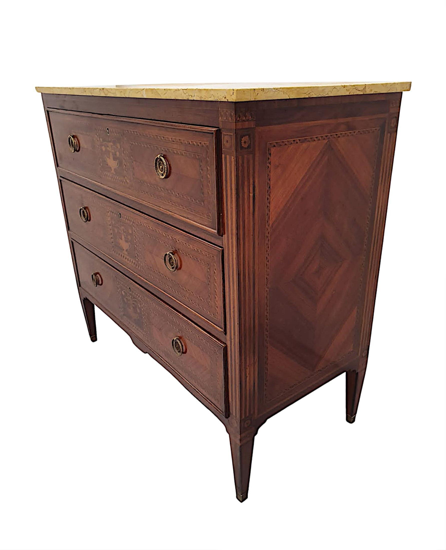 A fine early 20th Century richly patinated marble top chest of drawers, of fabulous quality, finely carved, crossbanded, quarter veneered and with stunning, highly inlaid marquetry panels throughout.  The gorgeous, moulded Sienna marble top of