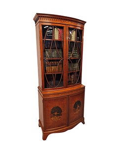 A  Fine Edwardian Marquetry Inlaid Bowfronted Bookcase afterf Edward and Roberts