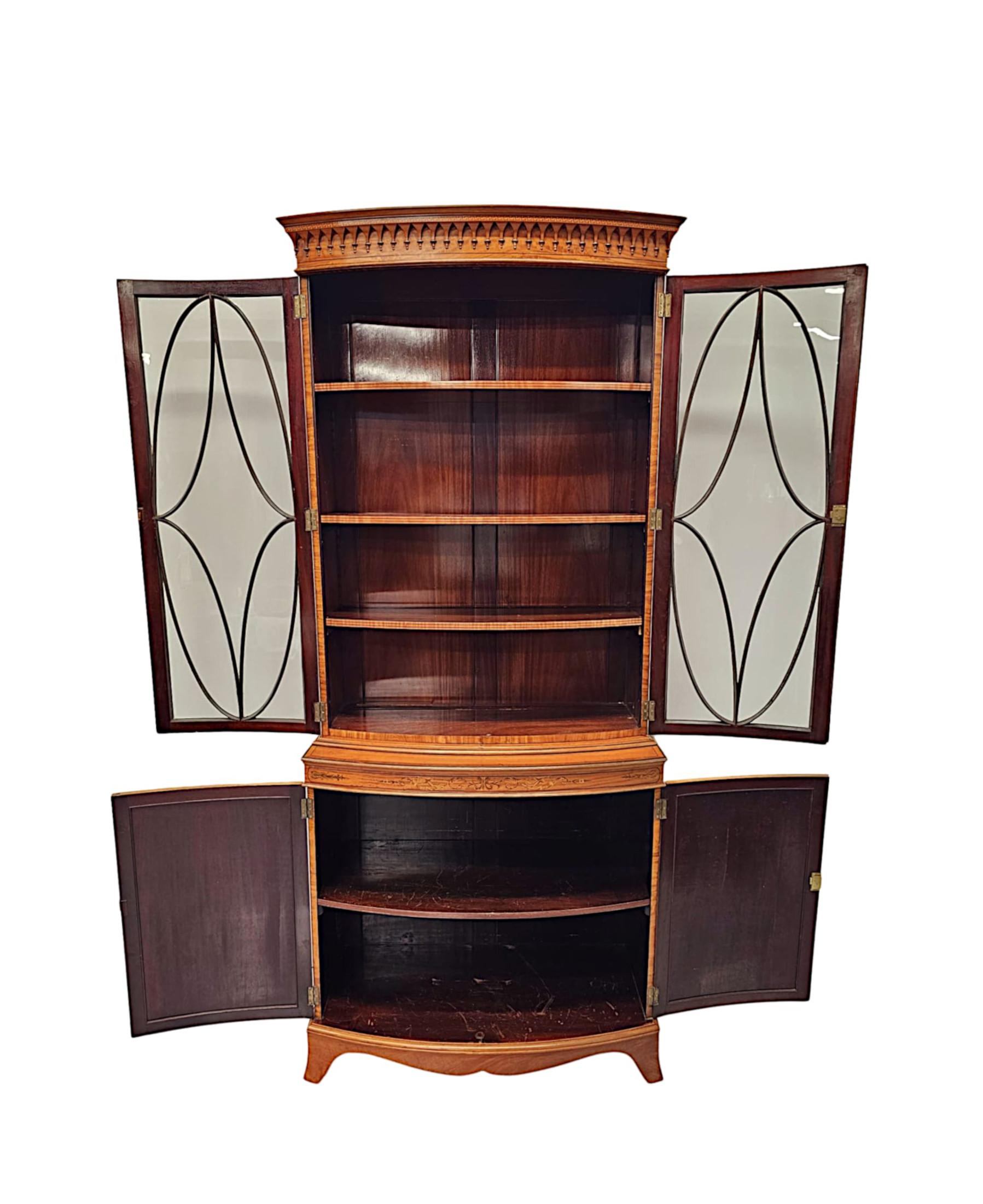 A  Fine Edwardian Marquetry Inlaid Bowfronted Bookcase afterf Edward and Roberts In Good Condition For Sale In Dublin, IE
