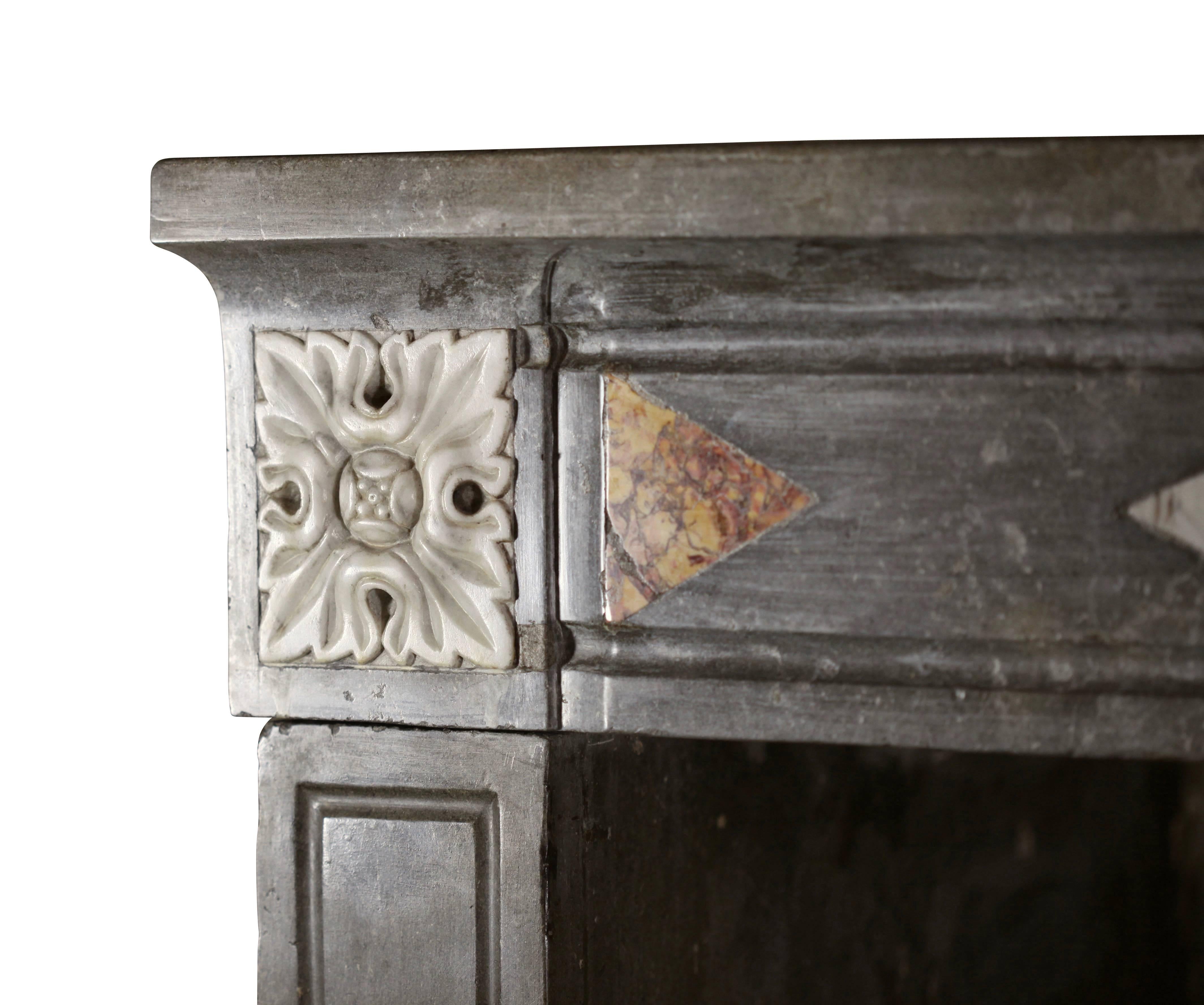 Carved Fine European Rustic Antique Fireplace Surround with Marble Inlays For Sale