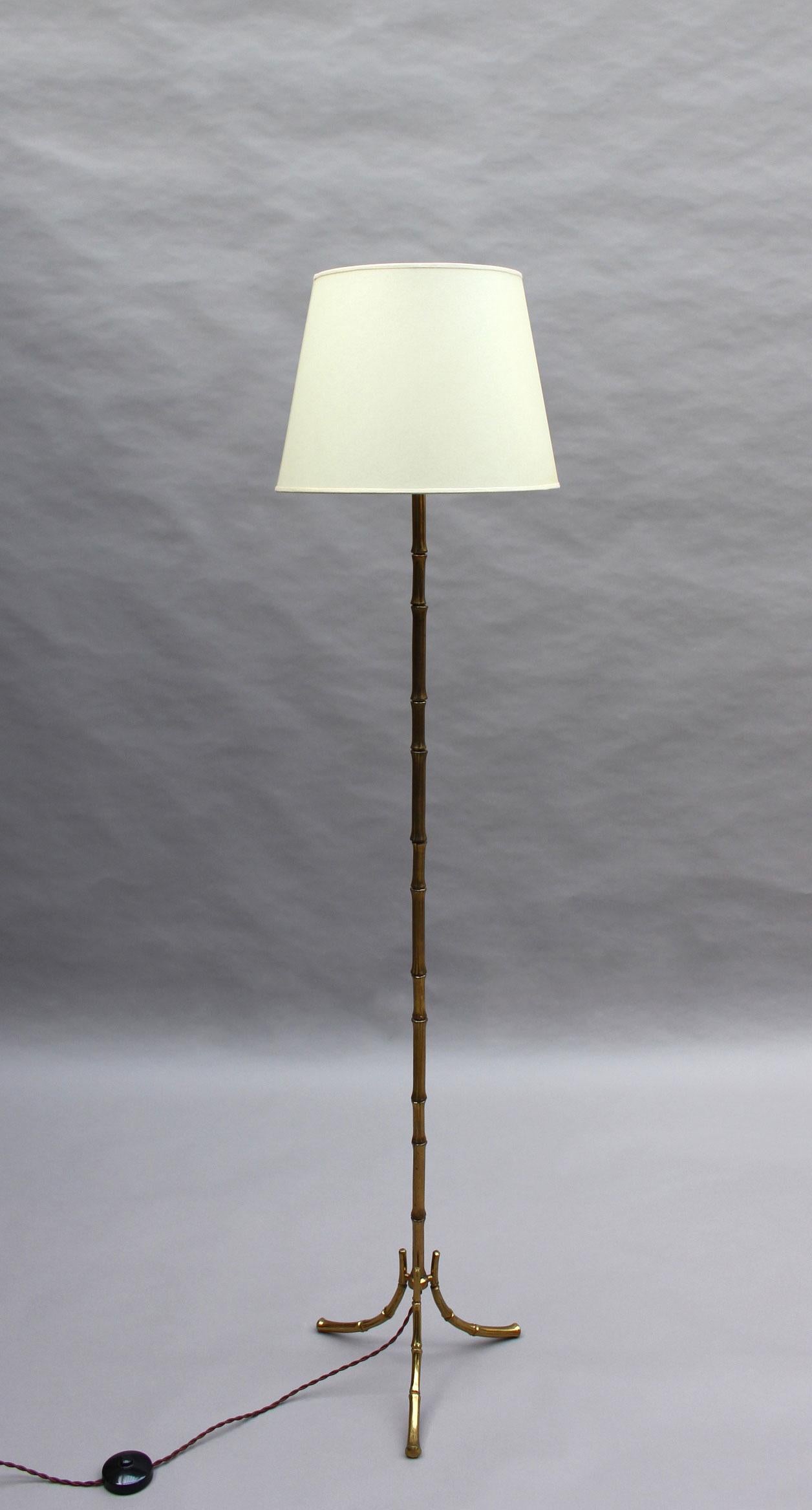 A French mid-century faux bamboo bronze floor lamp by Maison Bagues.
 