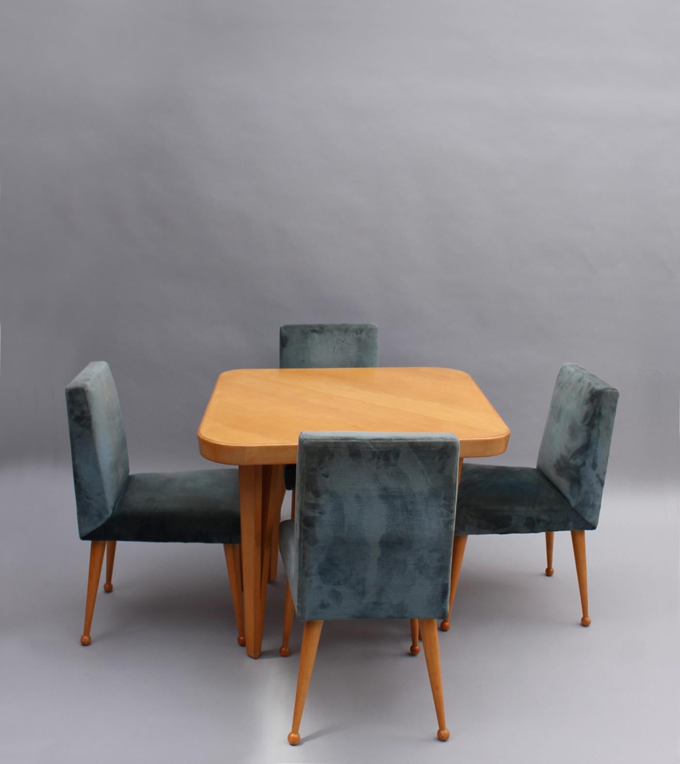 Comprises a diamond shaped extendable sycamore table with tapered legs and four chairs with sycamore tapered legs ending in a ball shape.

Dimensions of the table are:
H: 79cm – 31 1/8”
L: 129cm – 51” (229cm – 90” with center extension leaves)
D: