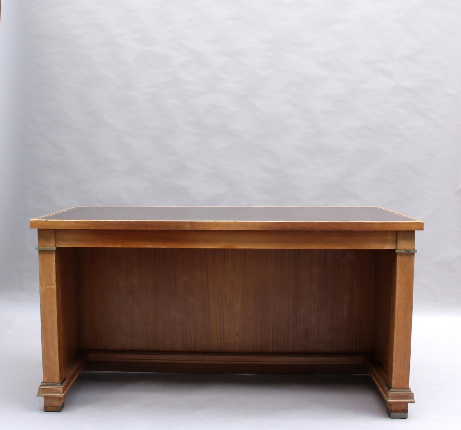 Jacques Adnet: A fine French mid-century mahogany desk with a leather top and bronze details.
Provenance: Palais des Consuls of Rouen, France.
2 desks available as well as two curved desks from the same provenance (ref. # LU784816309161).