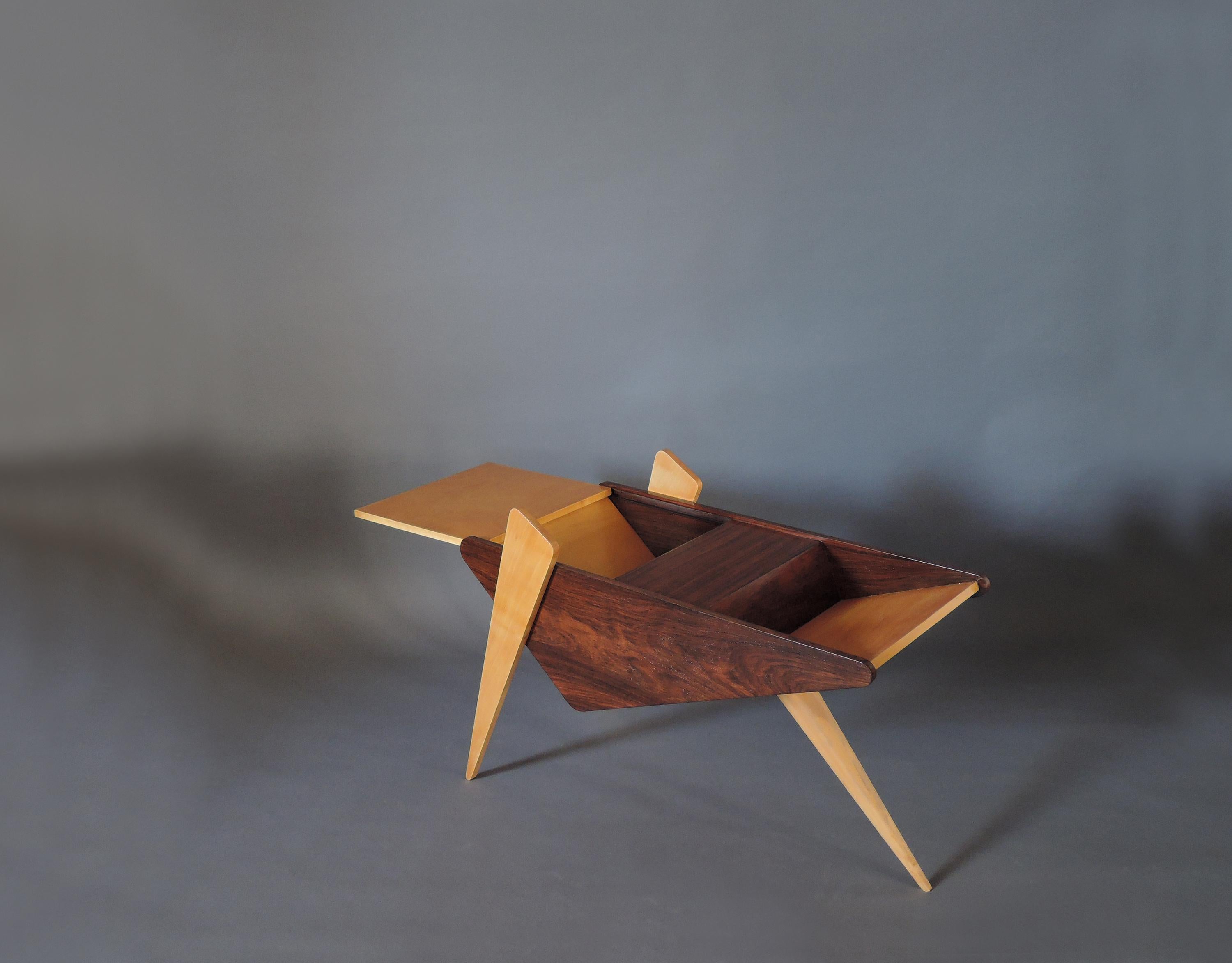 Unusual French mid-century rosewood and sycamore tripod side table / magazine rack with a partial sliding top.