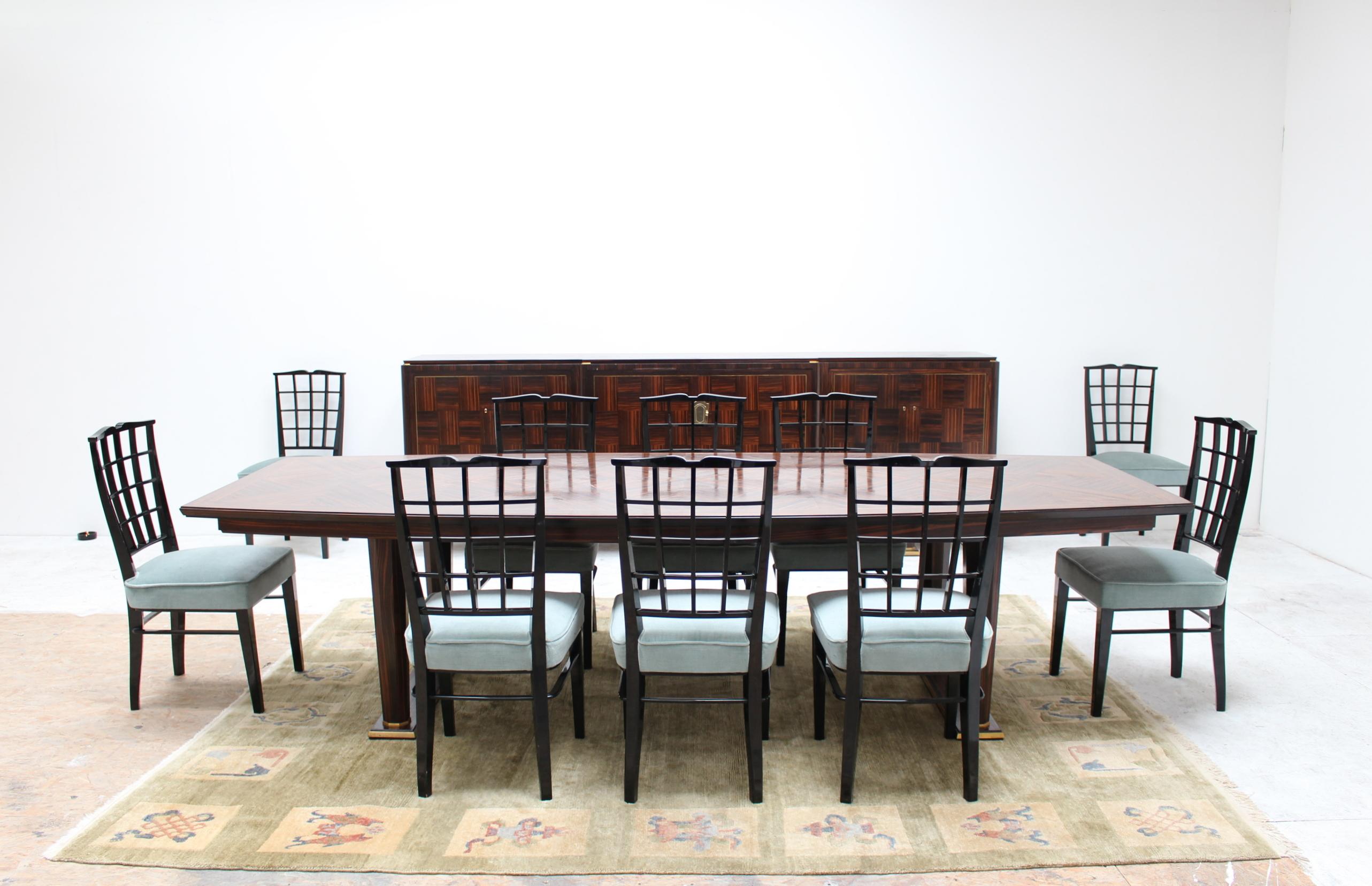 Composed of a Macassar ebony marquetry dining table and 6 door sideboard - both with bronze details - and 10 black lacquered chairs. Signed 
Dimensions:
Sideboard: H: 40 1/8