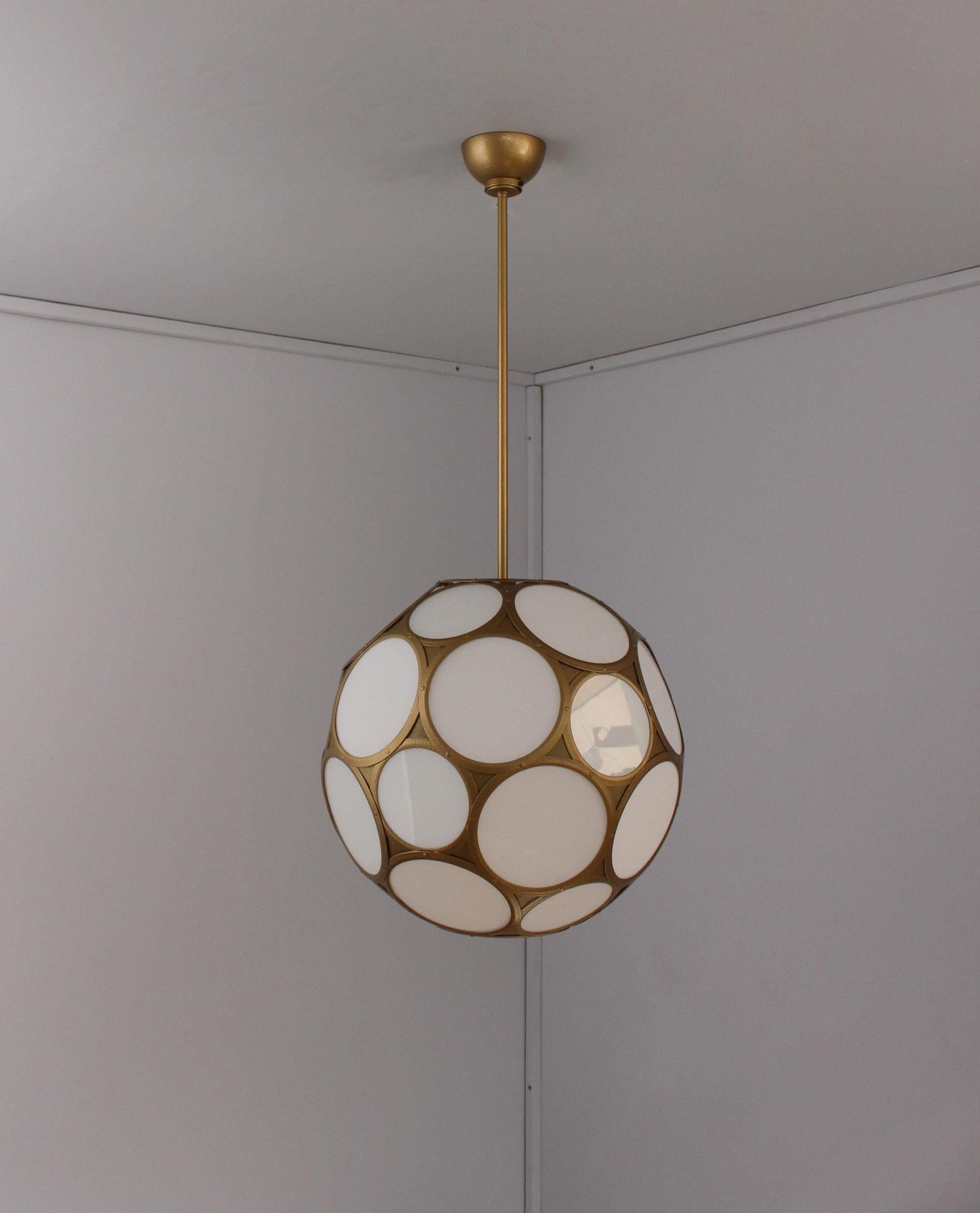 With round white enameled glass inserts forming a multifaceted sphere suspended from a golden painted metal rod and canopy.

  