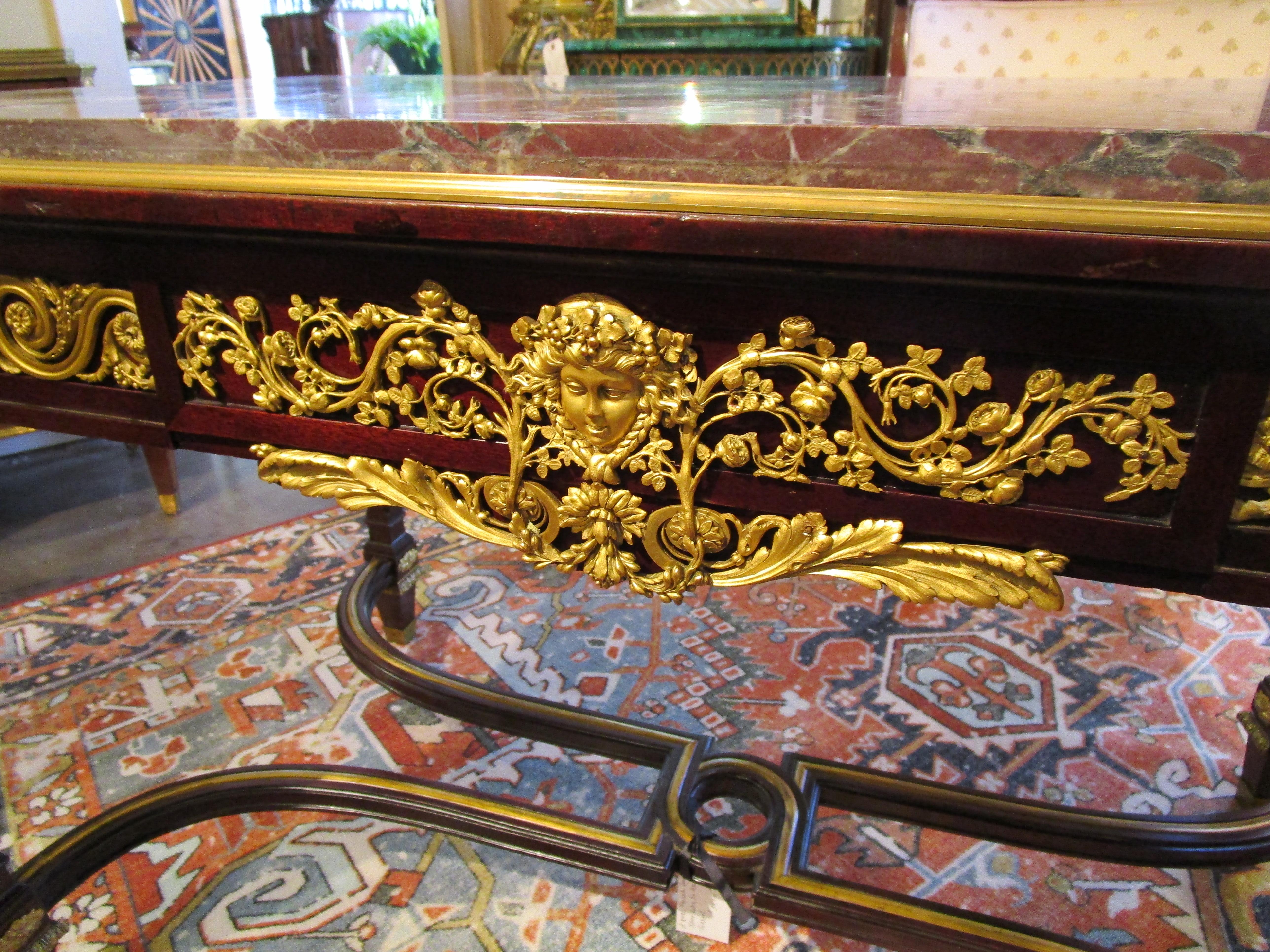 A very fine 19th century French Louis XVI center table by Maison Forest. Mahogany and fine gilt bronze mounts. Original Breccia marble top.