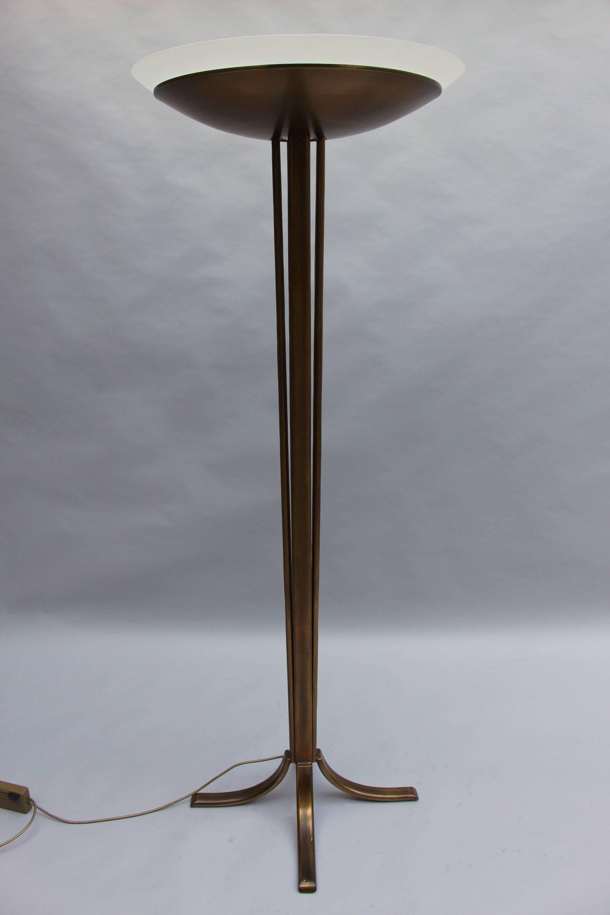 A fine French 1940s patinaed bronze floor lamp by Perzel with a bronze and glass bowl and a four-stem cross-shape base.