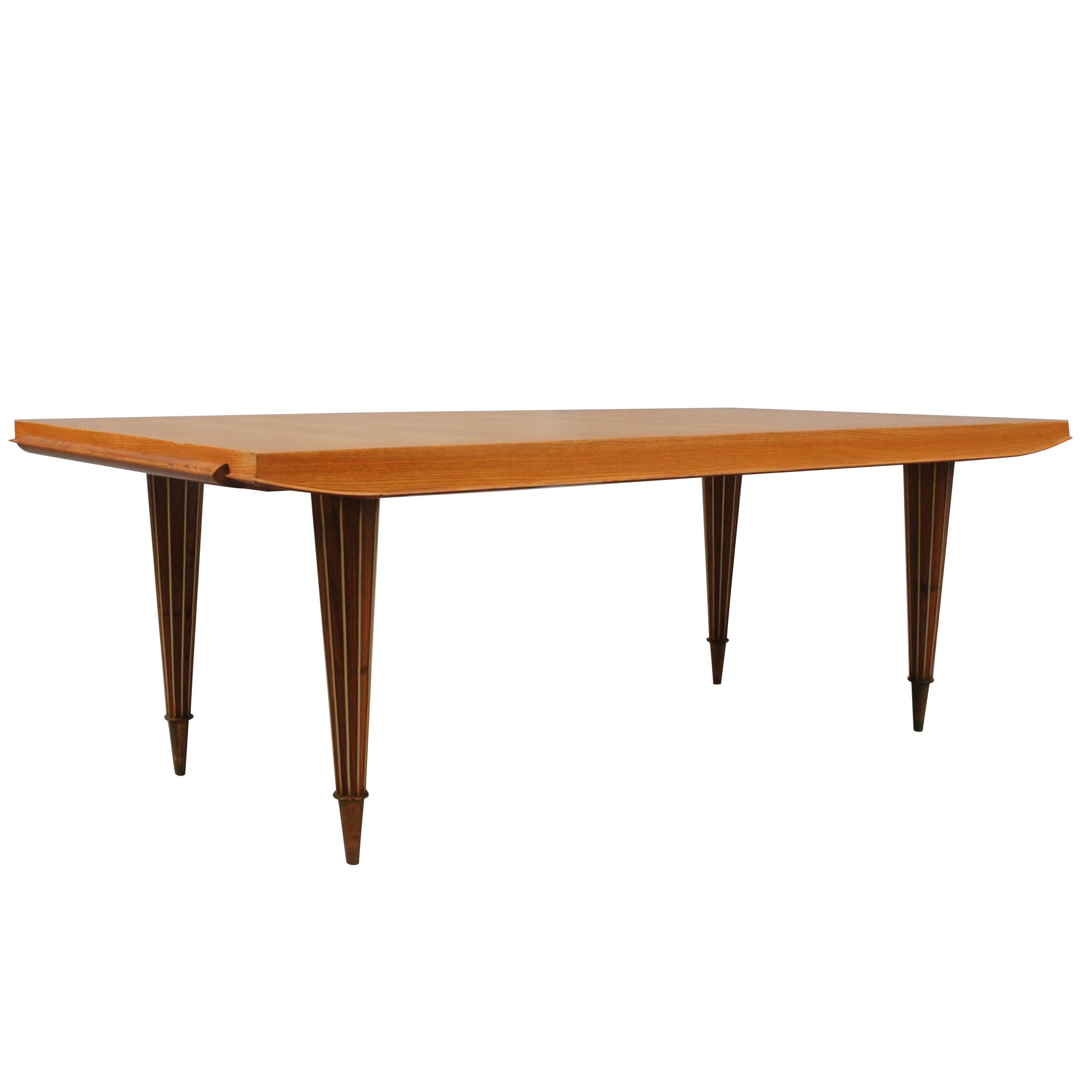 A Fine French Art Deco Expandable Dining Table with Ribbed Brass Conical Legs For Sale