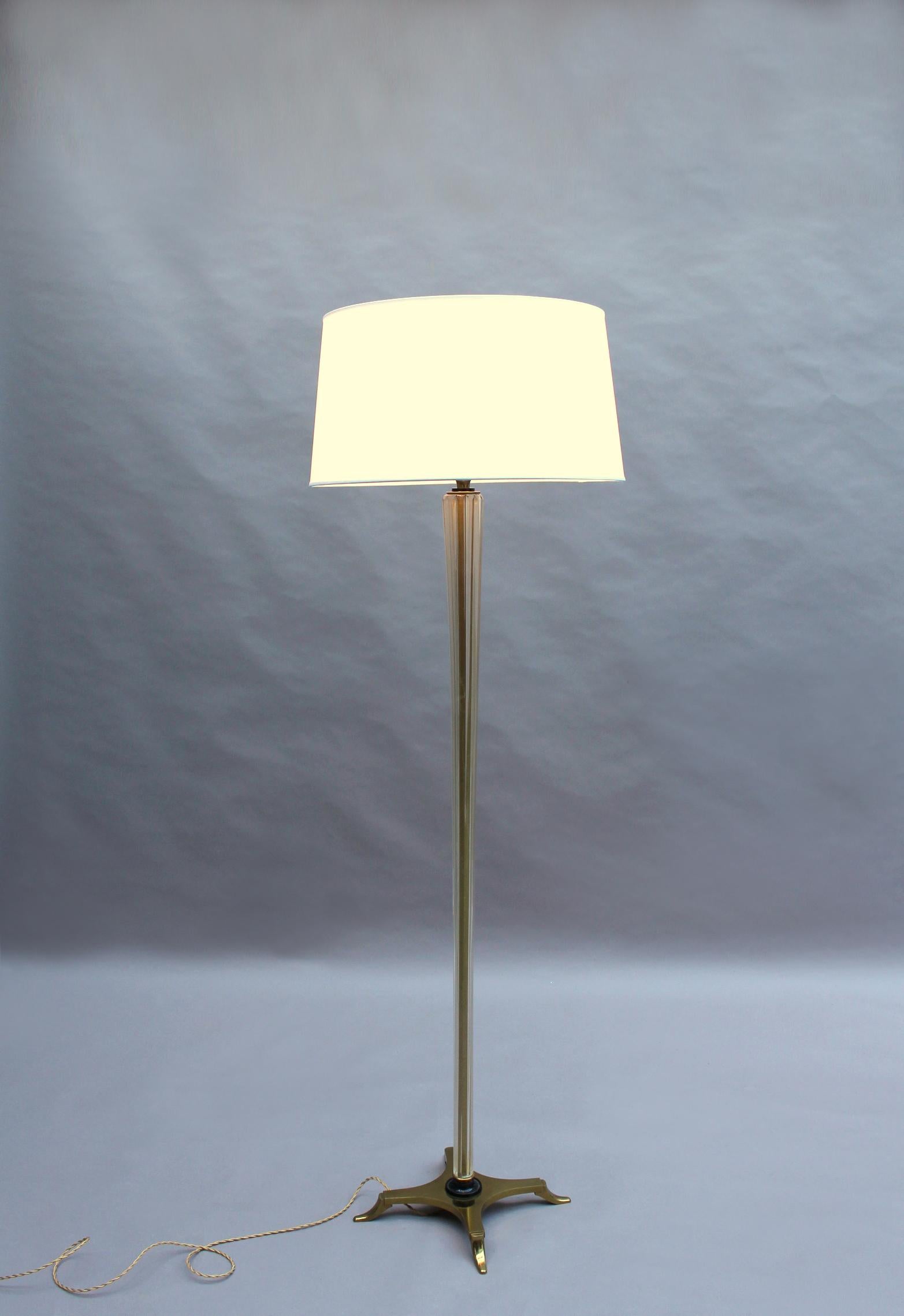 With a bronze cross-shaped base and a glass in gold dust fluted stem that holds a new shade. 
Price includes re-wiring.