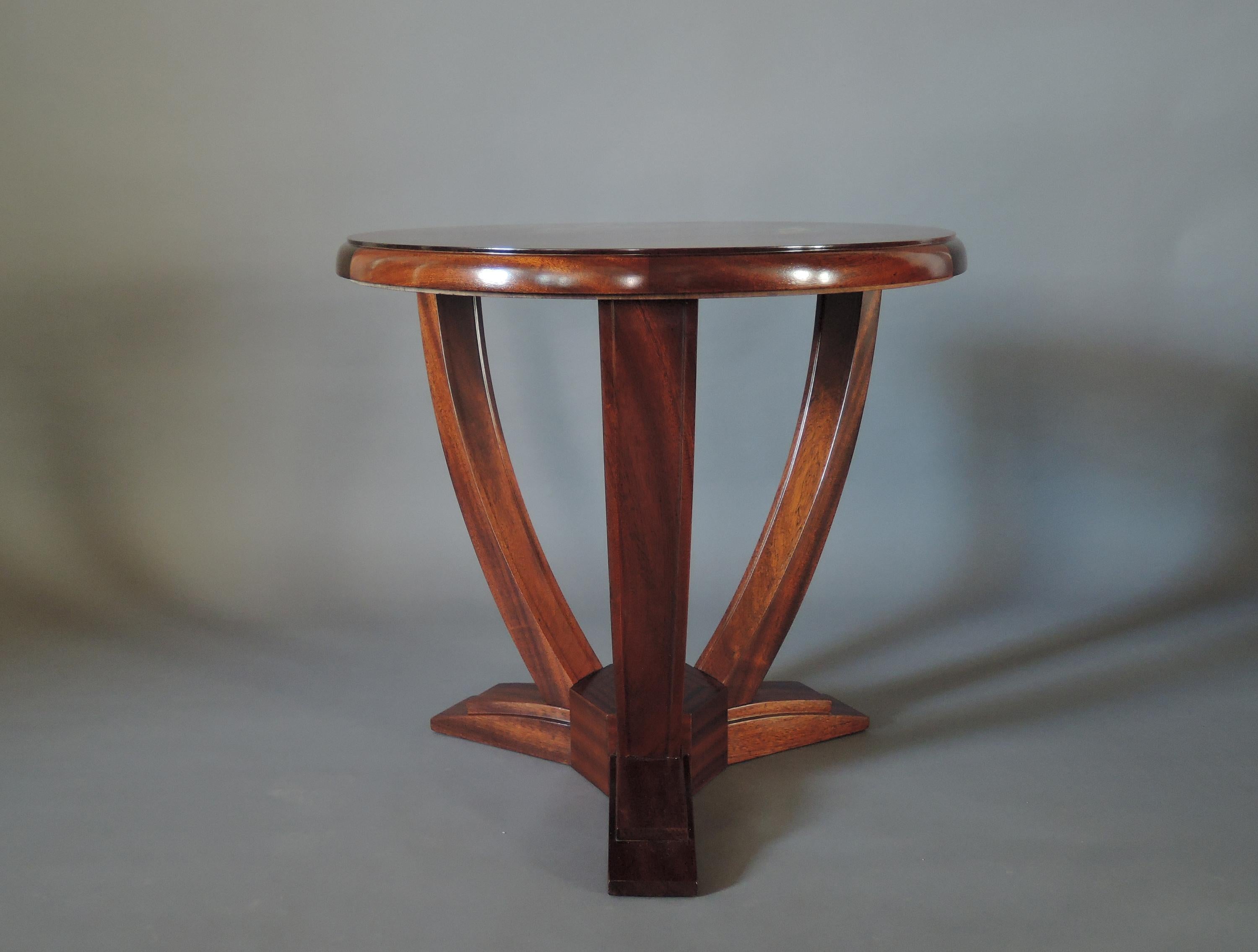 A fine French Art Deco tripod solid mahogany Gueridon or side table.


  