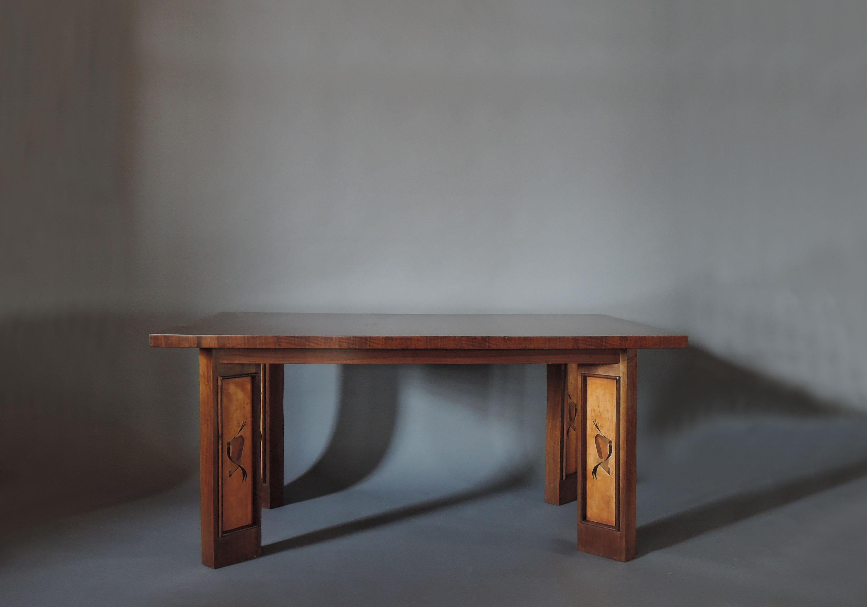 A fine French Art Deco walnut and sycamore dining / writing table with marquetry details.

   