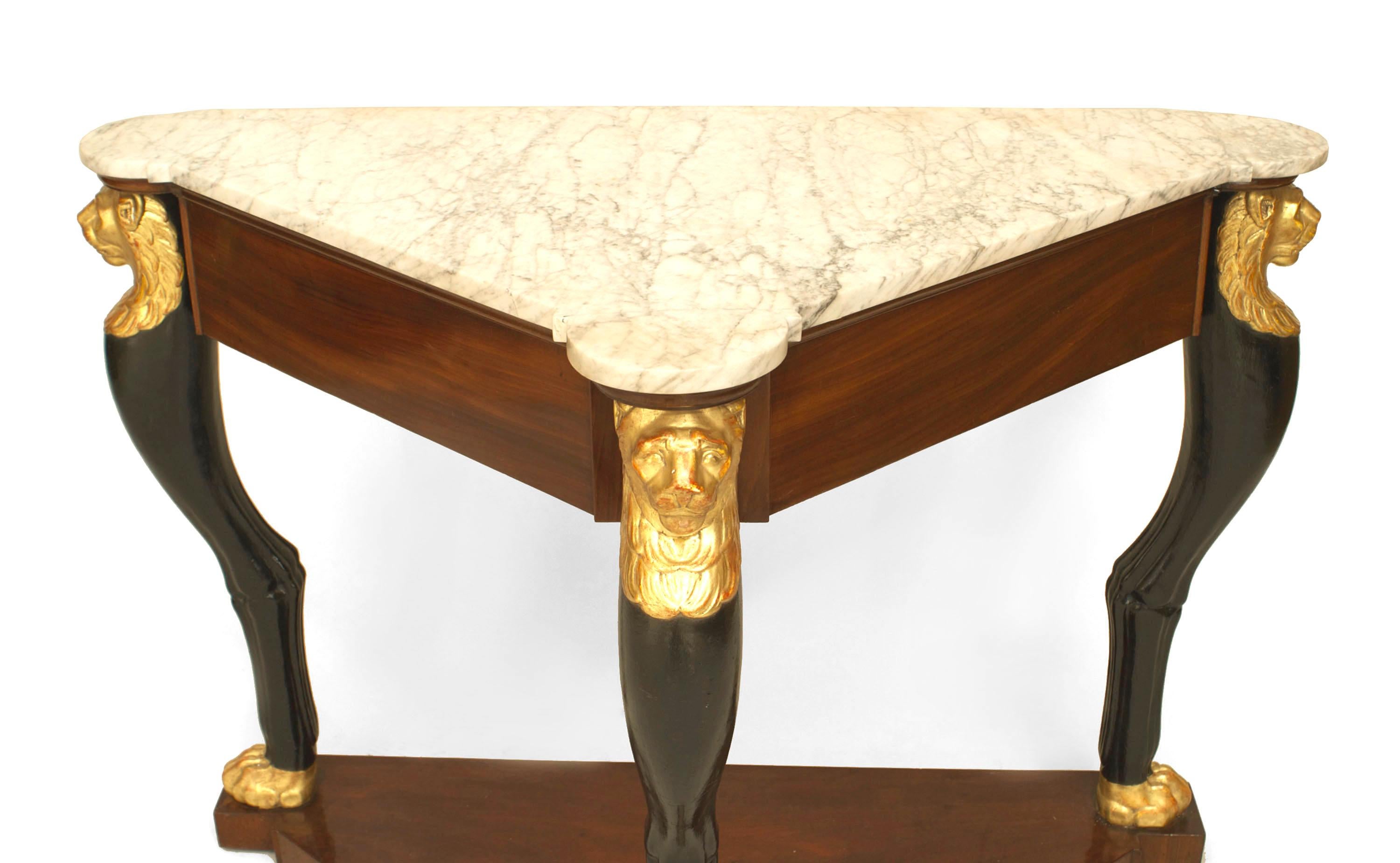 French Empire triangular shaped mahogany console table with 3 ebonized and gilt lion head legs with claw feet resting on a platform base under a white marble (top stamped JACOB-D-/R-MESLEE)