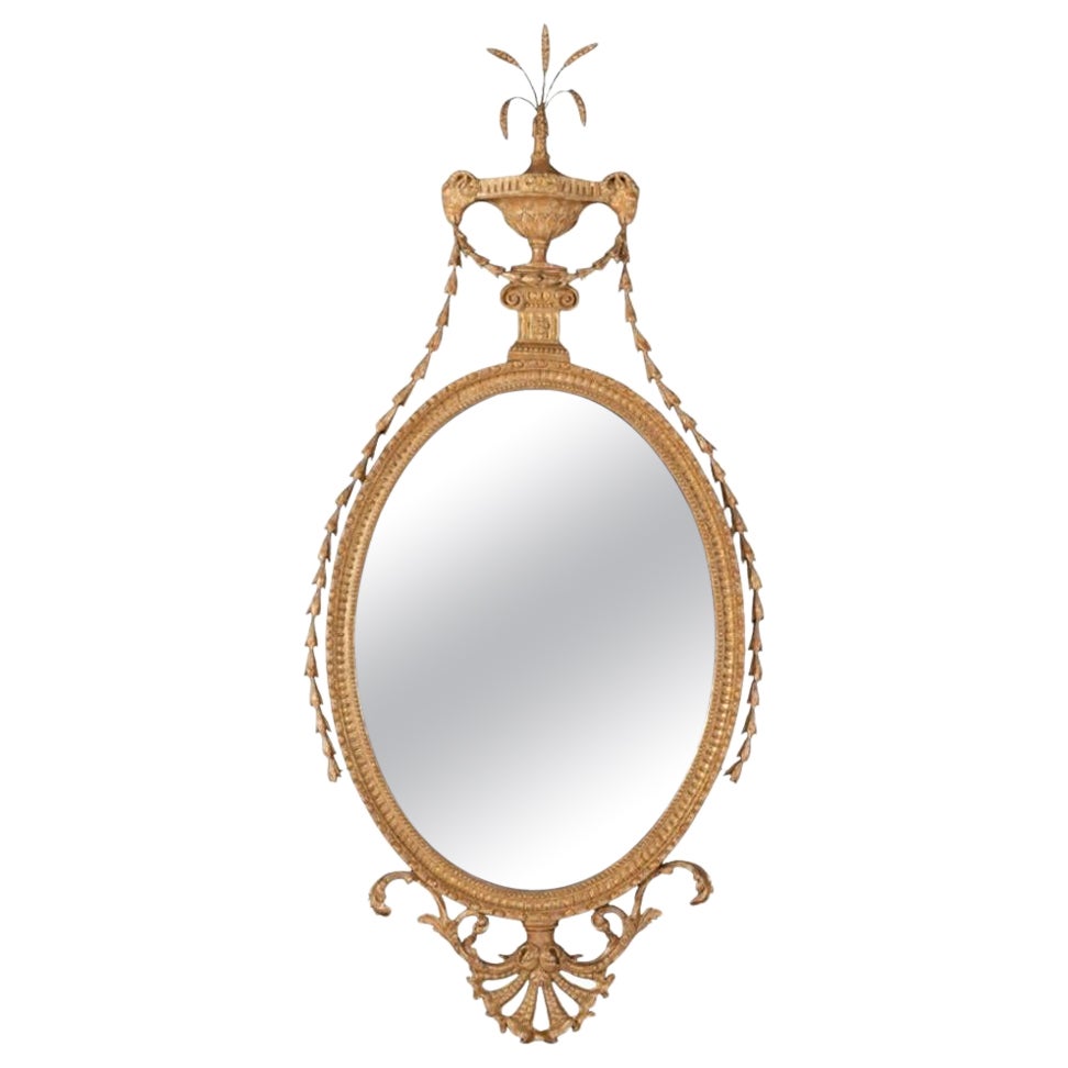 Fino espejo oval de madera dorada de la época de Jorge III atribuido a John Linnell