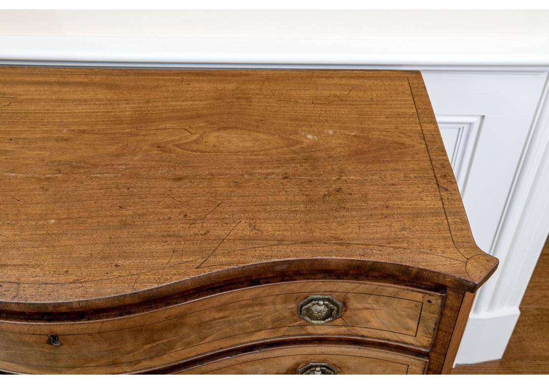 A Fine George III Serpentine Chest For Sale 10