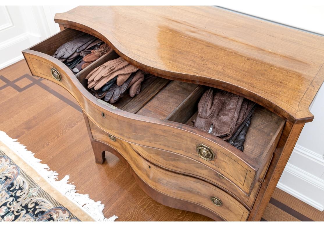 19th Century A Fine George III Serpentine Chest For Sale
