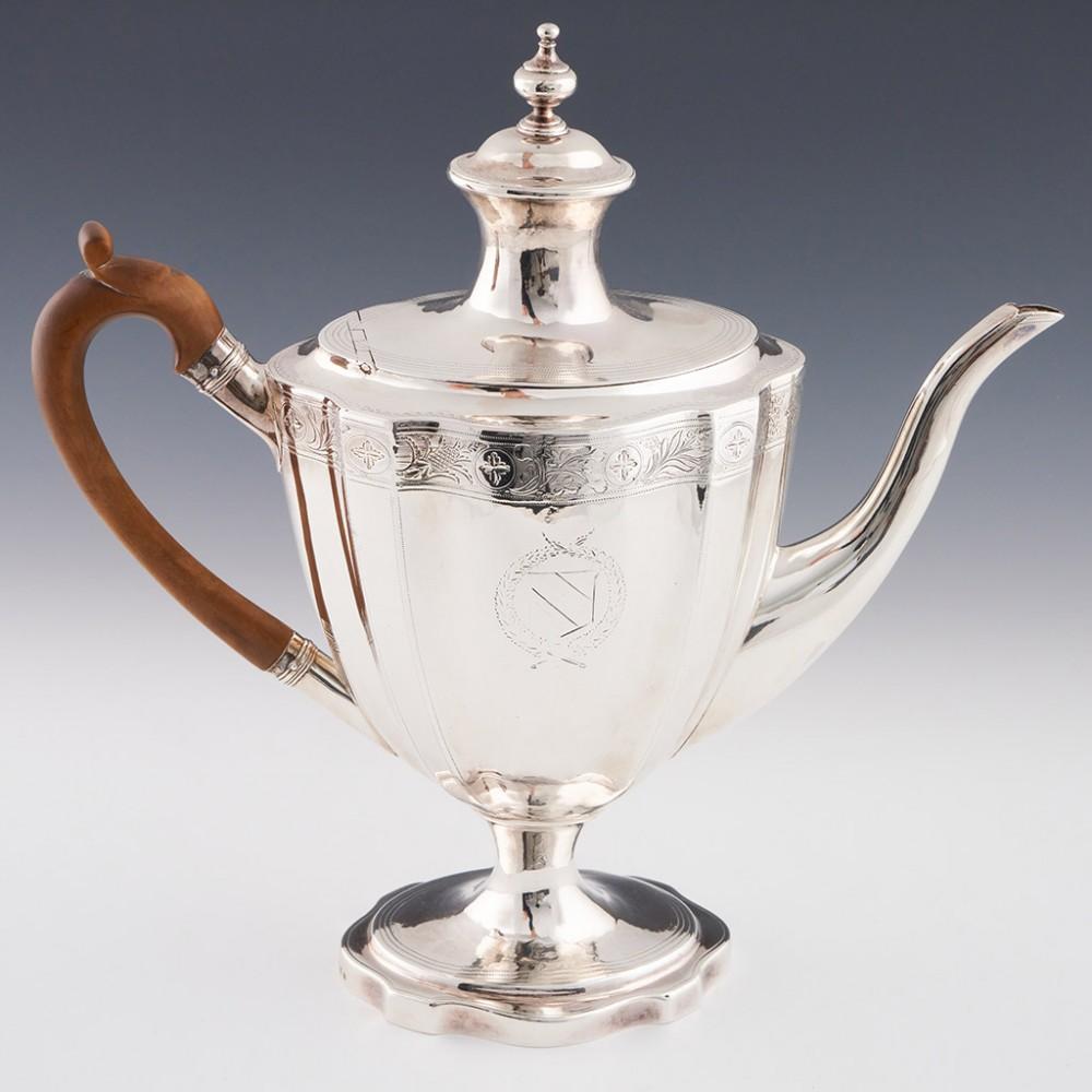 A Fine George III Sterling Silver Coffee Pot London, 1796

Additional information:
Date : Hallmarked in London 1796 For James Mince
Period : George III
Origin : London England
Decoration : Flat hinged lid with pedestal finial. A chased band of mixed