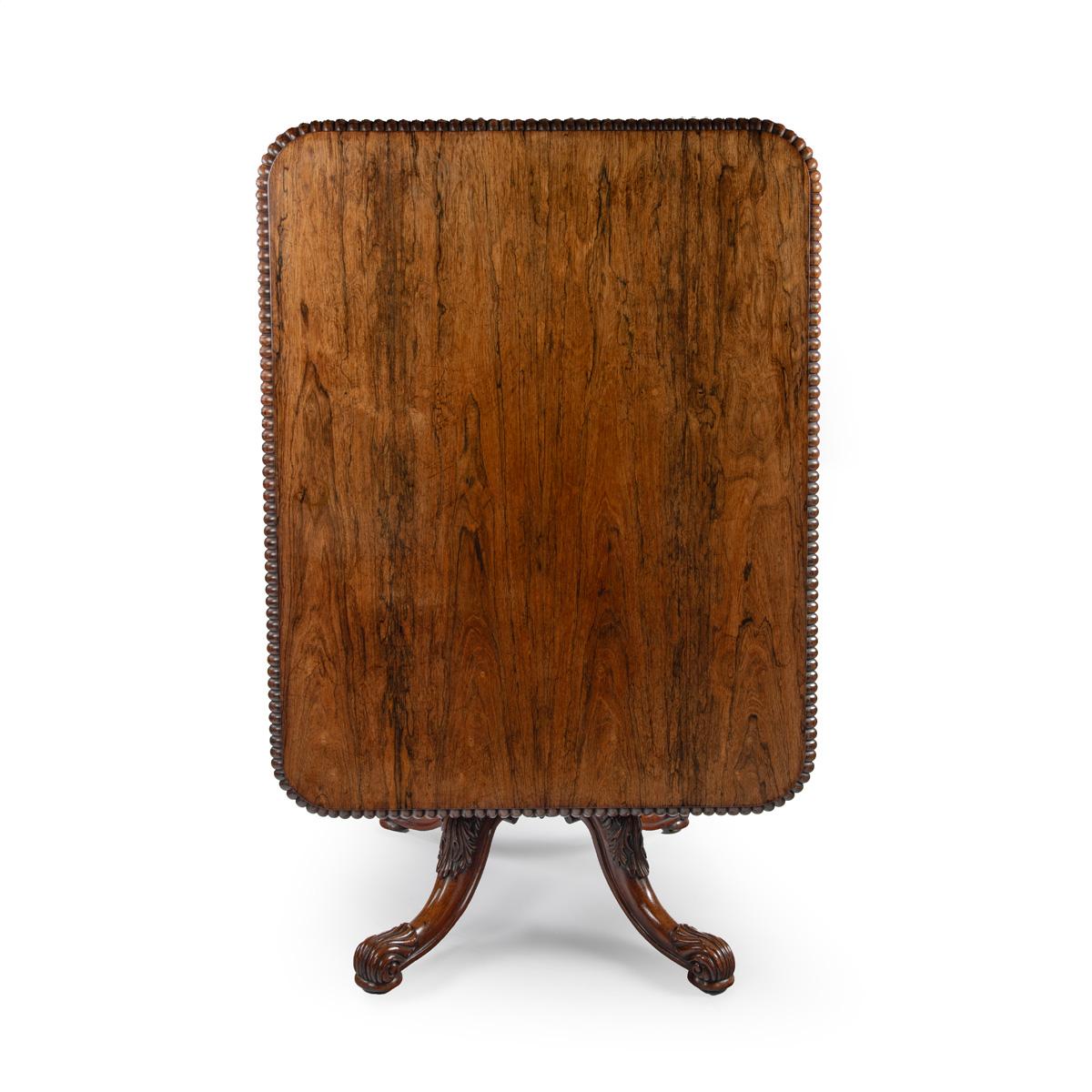 A Fine George IV Period Breakfast Table, Stamped by the Maker, Gillows of Lancaster, c.1825 Of rectangular form with rounded corners and veneered throughout in Brazilian rosewood of the finest colour and figure. The edge of the table top with a band