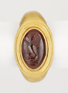 A Fine Greek Finger Ring Set with a Garnet Intaglio of a Lion