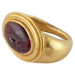A Fine Greek Finger Ring Set with a Garnet Intaglio of a Lion