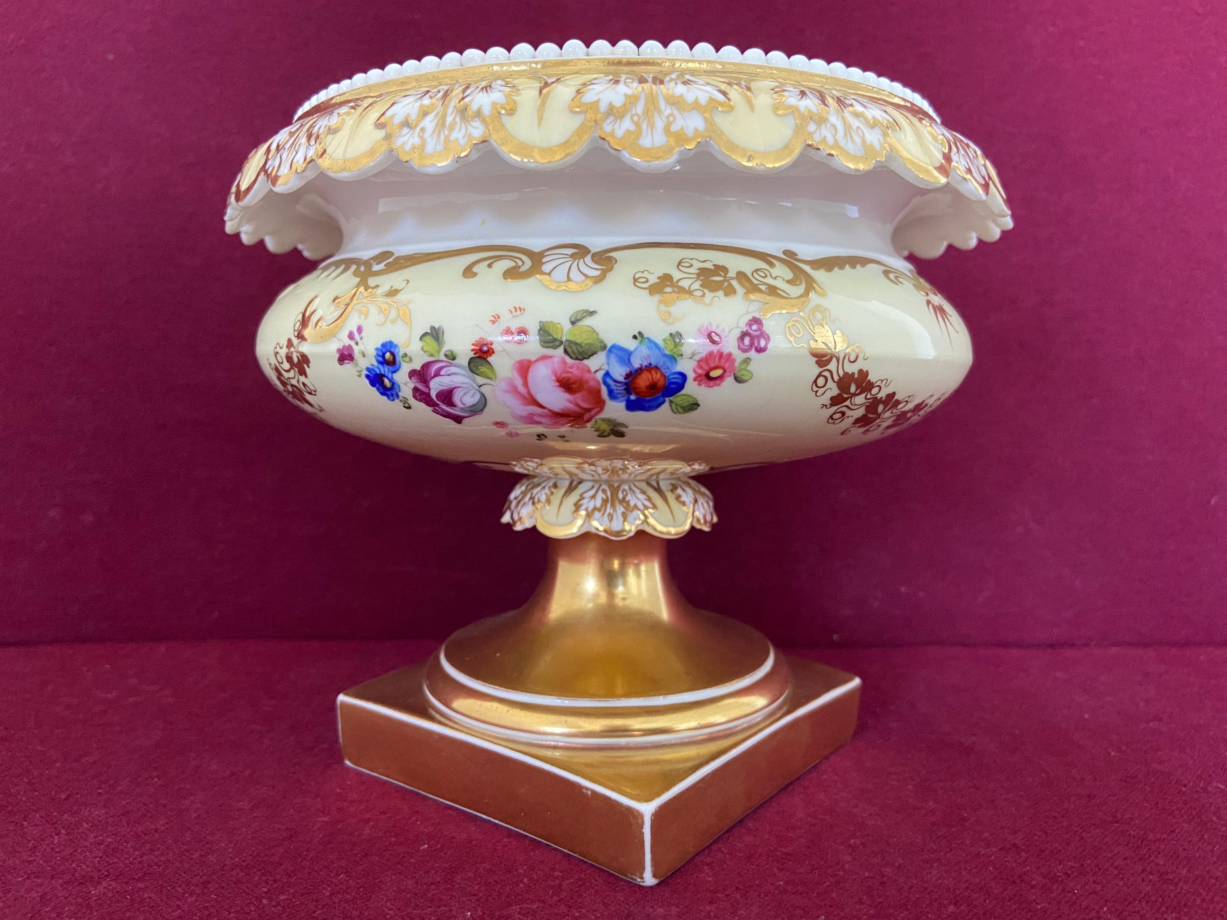 A fine H & R Daniel porcelain comport c.1830. Decorated with a pale yellow ground and flowers. Marked Pattern 453 (the last digit is unreadable).

Condition: Hairline crack to the rim. 