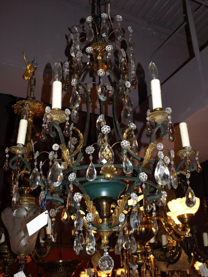 A fine iron, gilt bronze and crystal chandelier by Maison Jansen.
France, circa 1920. 6-light.
Dimensions: Height 38