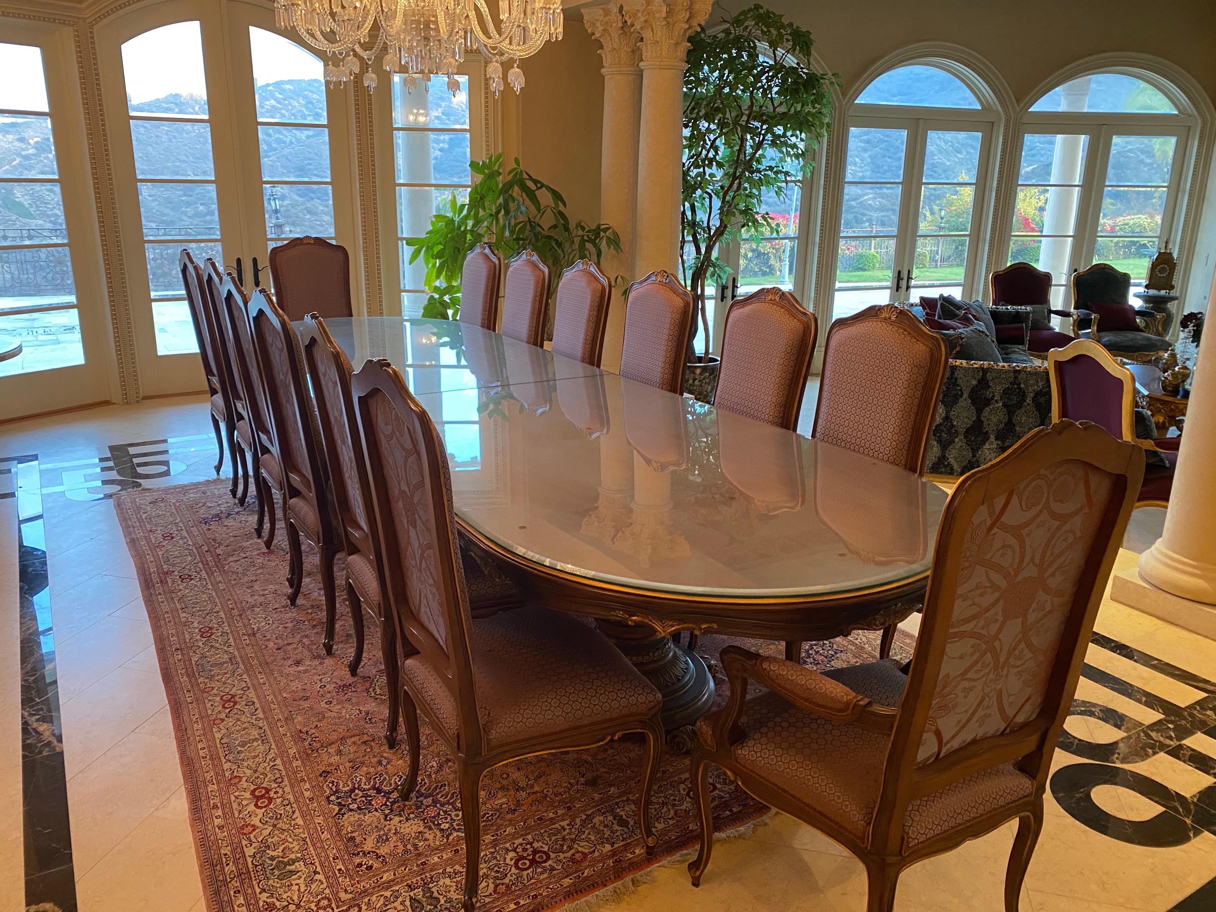 A Custom Made Italian Mahogany Dining Room Table and Fourteen Chairs 

The table was never used, chairs and table in excellent condition

For any questions or concerns, please do not hesitate to ask. 

