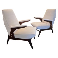 A Fine Italian pair of walnut framed armchairs in cream velvet