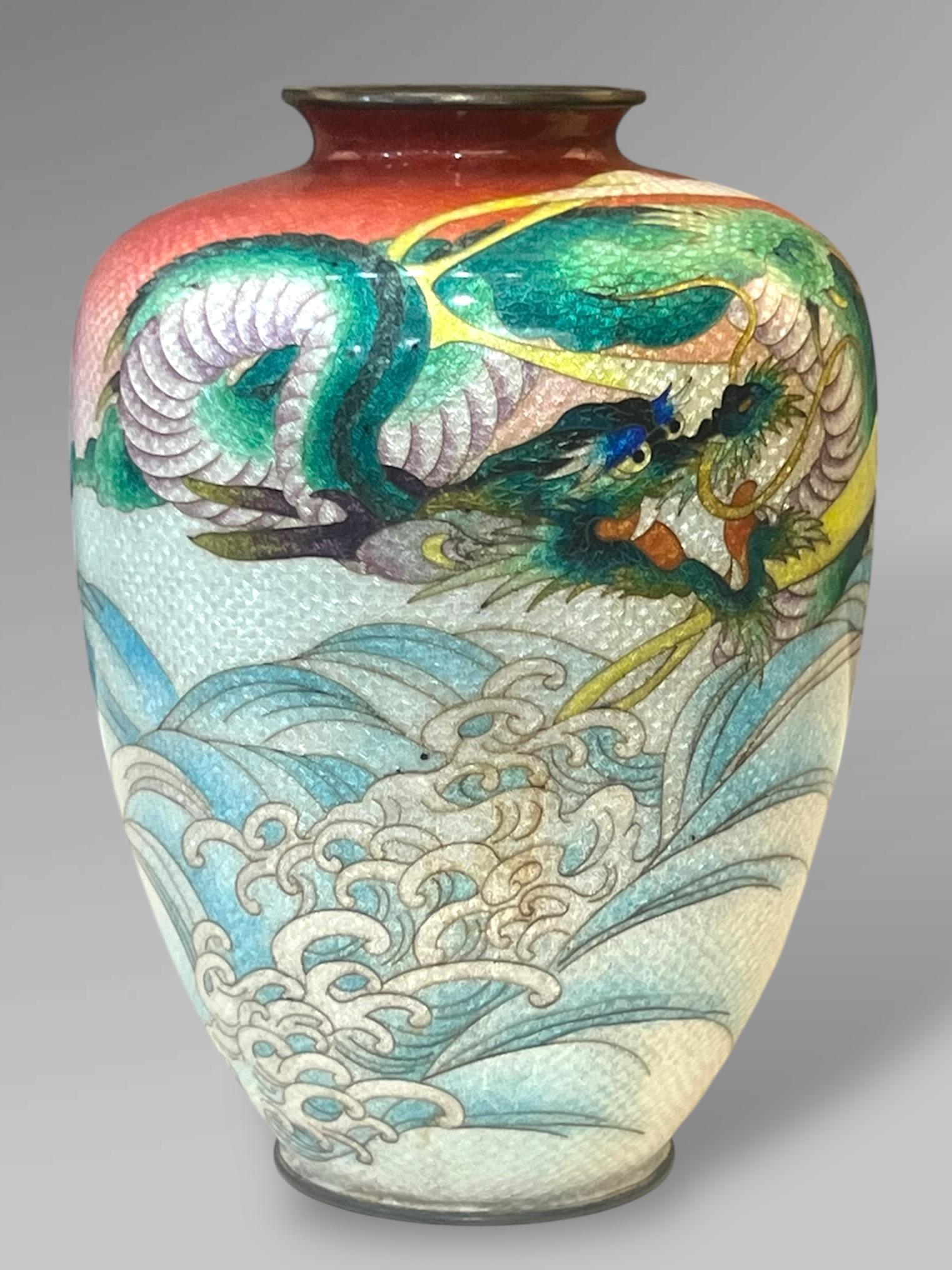  Japanese Cloisonné Enamel Vase with Dragon and Waves, Signed Kumeno Teitaro

Meiji Period (c. 1910–1920)
Height: 18 cm Width: 12.5 cm

A superb Japanese cloisonné enamel vase of baluster form, decorated with a dramatic scene of a dragon emerging