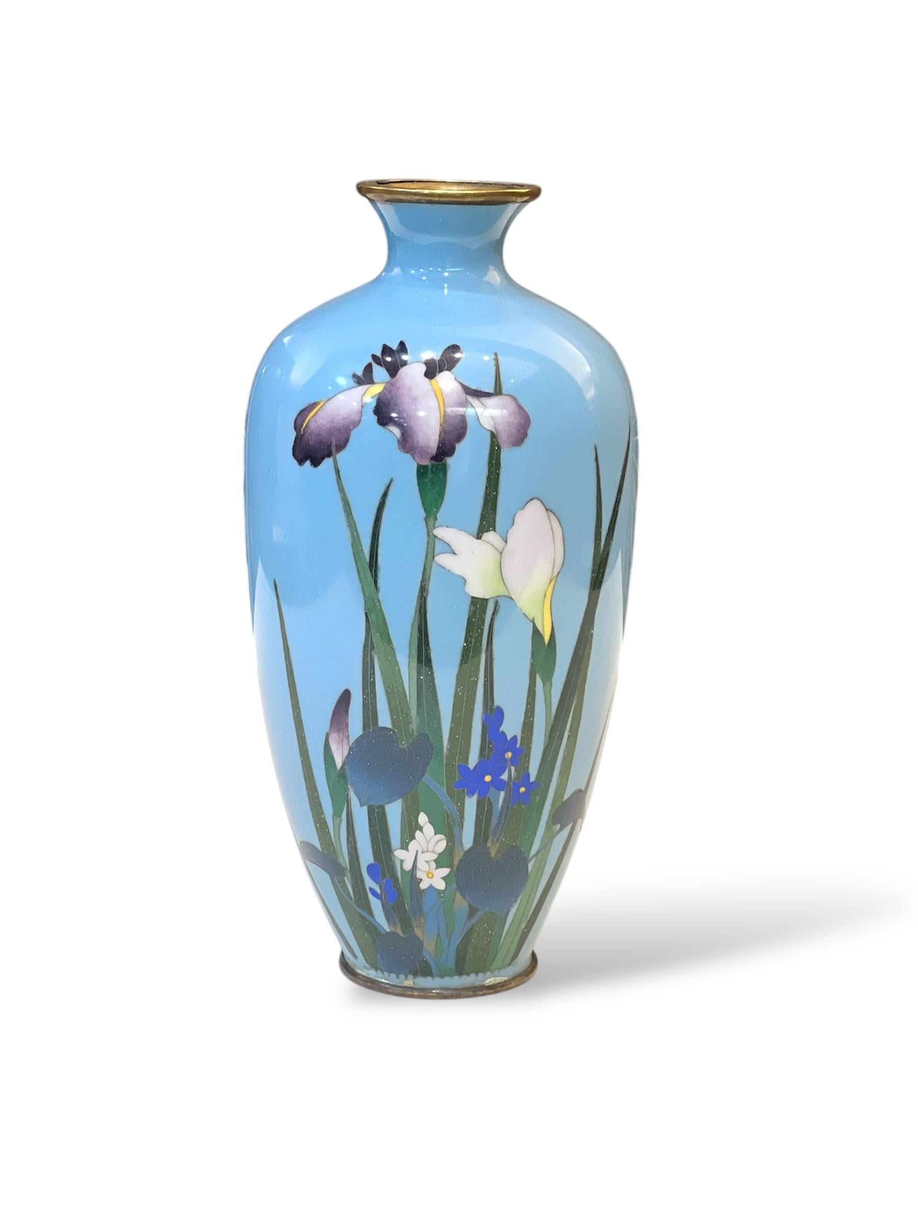 A Fine Japanese Cloisonné Enamel Vase with Irises. Meiji period 

Attributed to a Nagoya workshop, bearing the ‘three peaches’ mark

Meiji period. 

A finely worked Japanese cloisonné enamel vase of elegant baluster form, with a flared mouth and