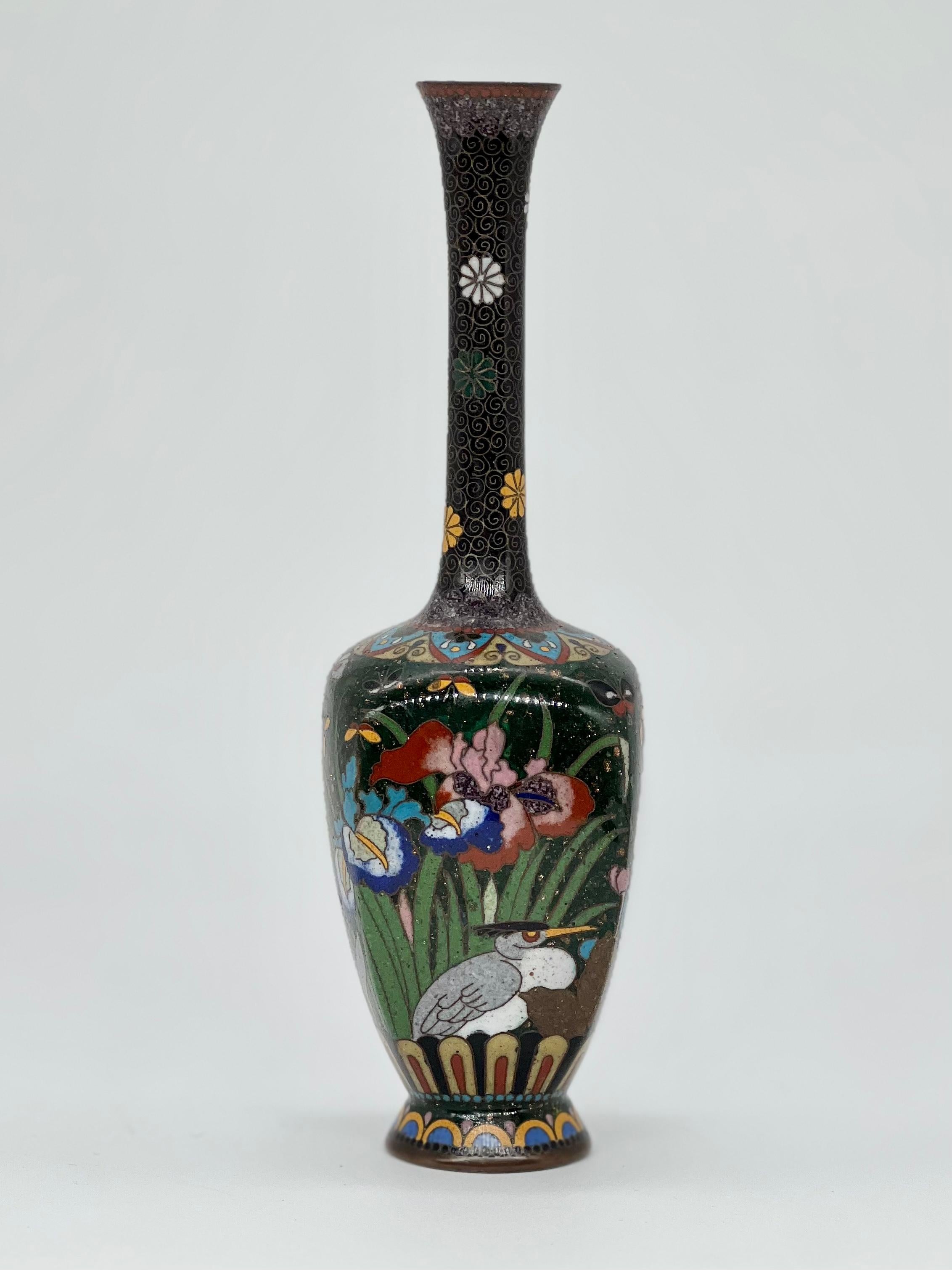 A fine Japanese Kyoto Shippo Cloisonne enamel vase 19th C 
Meiji Period 

JAPANESE CLOISONNE ENAMEL VASE,?decorated with cranes and butterflies amongst lotus and iris blooms reserved on a gold flecked green ground. 

In good condition.

Size: