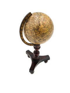 A fine J.S. Cox terrestrial pocketglobe in its stand.