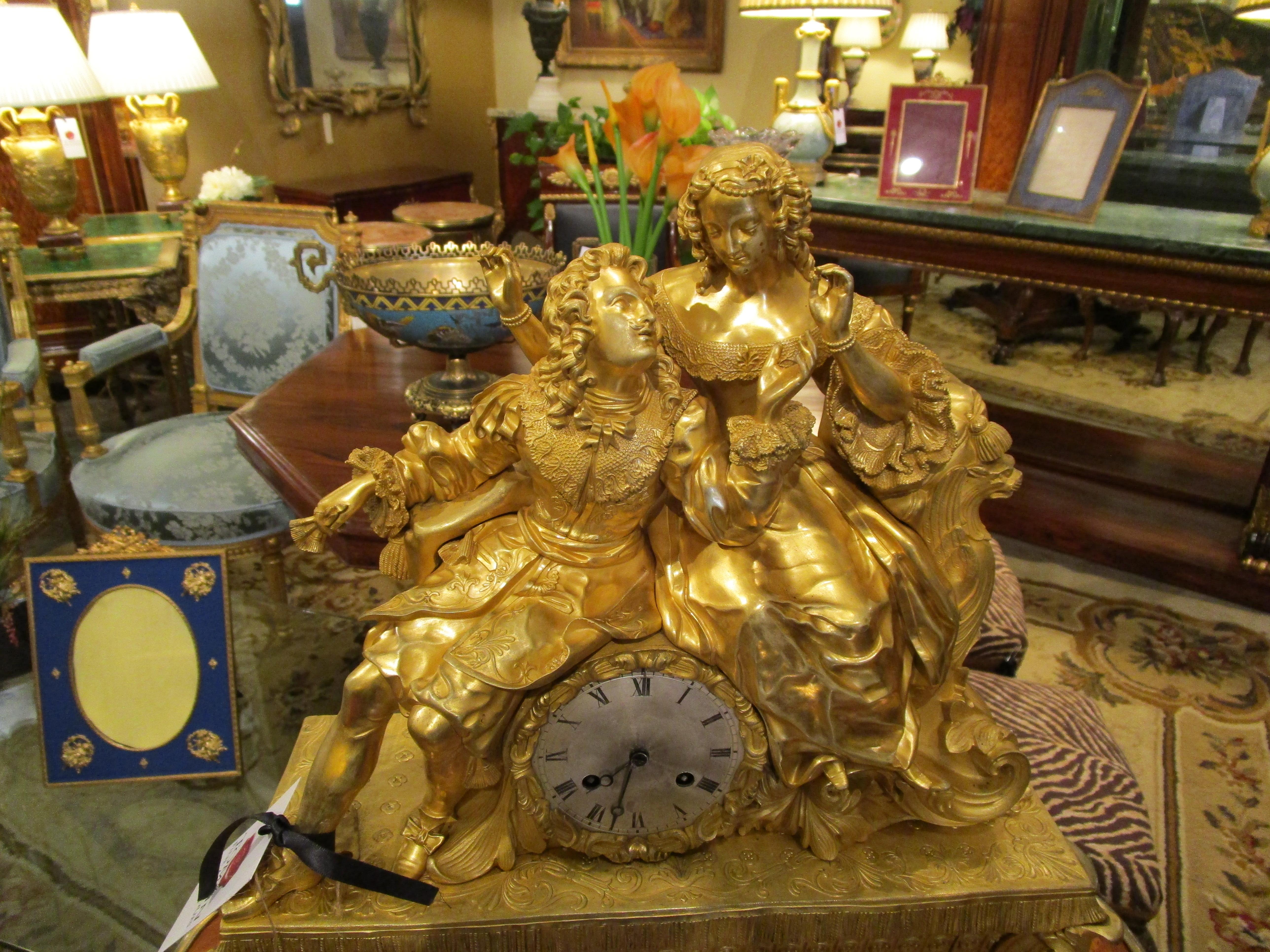 A fine 19th century Louis Philippe fire gilt large mantel clock. Depicting Louis XV and his wife Marie Leszczynska