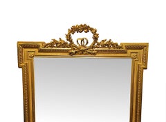 Un bellissimo specchio da salotto o da caminetto del XIX secolo, in legno dorato, di grandi dimensioni, con decorazioni a nastro