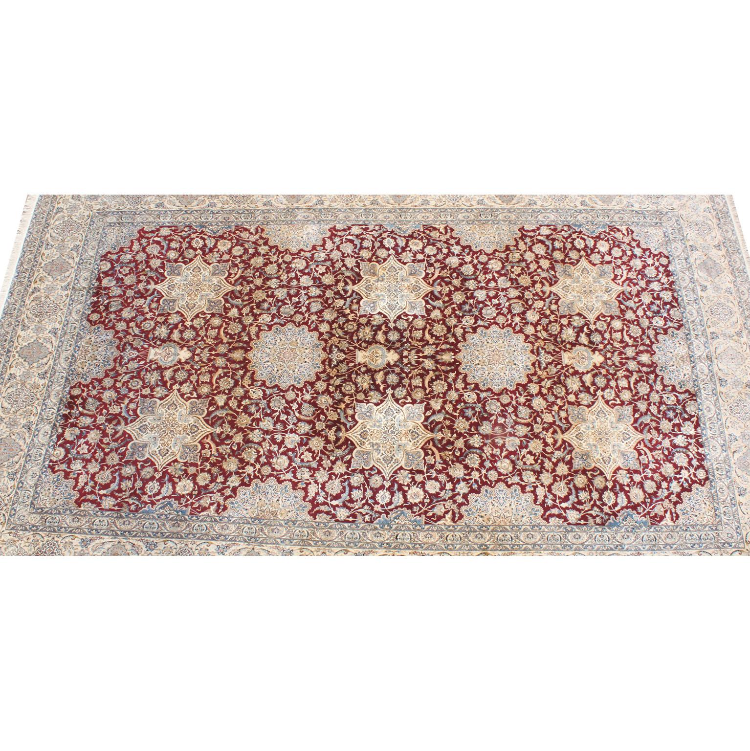 A Palatial Persian Nain hand-knotted wool and silk Pile area rug. The very large and impressive vibrant and colorful medallion carpet with red-burgundy, ivory-beige, blue-Celeste and gold floral designs in a middle eastern flavor. Circa: Mid to
