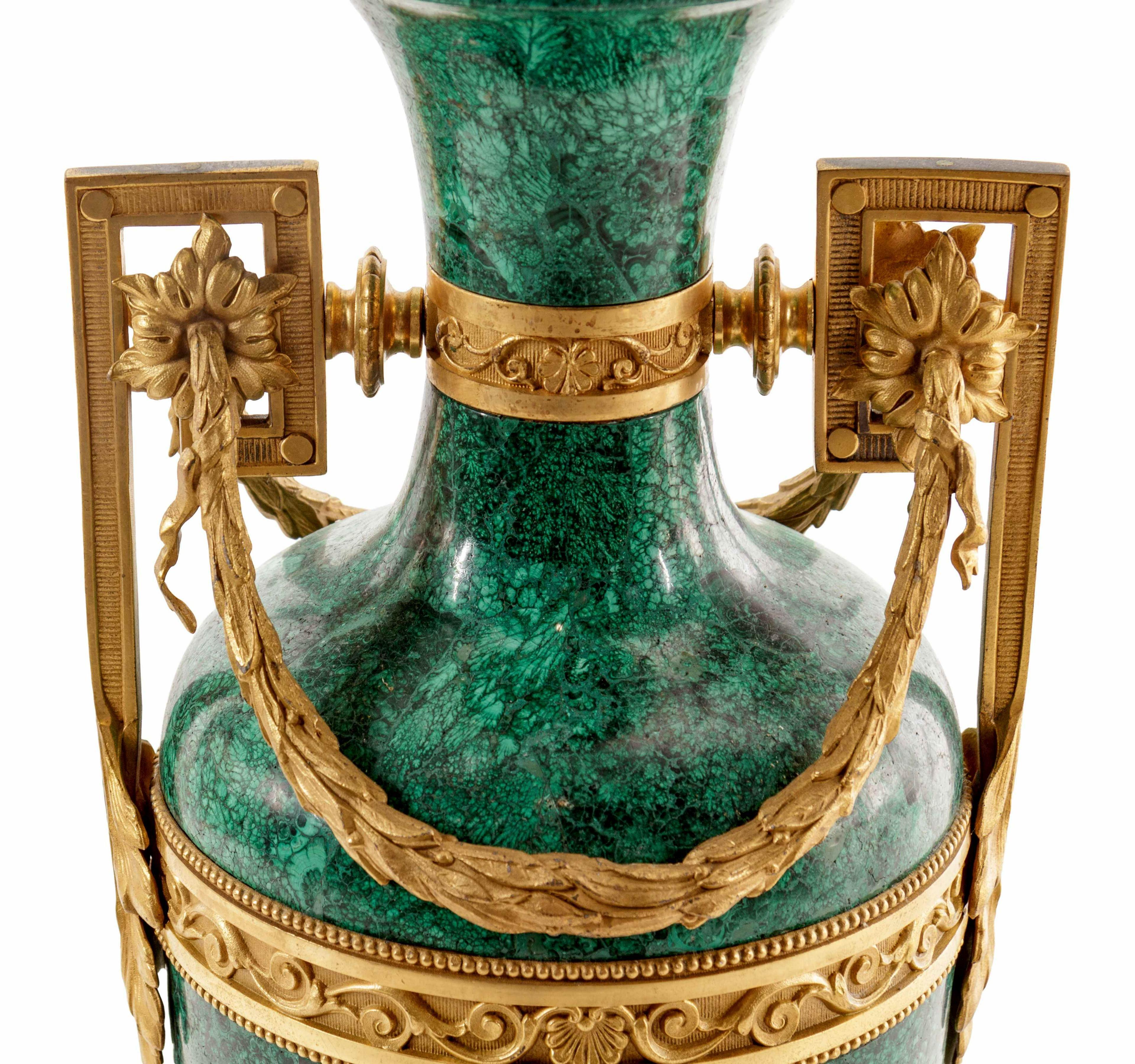 A fine large early 20th century Louis XVI style gilt bronze mounted malachite urn.

  
 