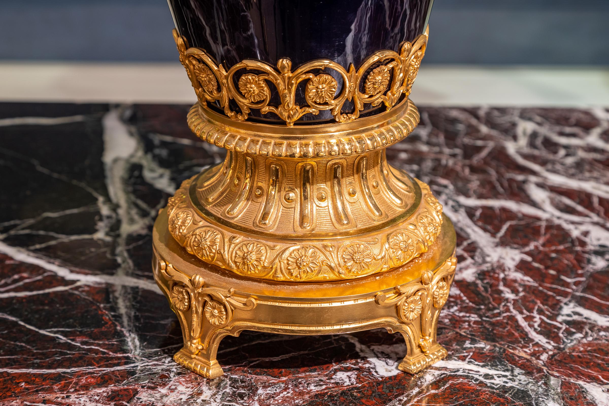 A very fine and large 19th century French Sevre's style cobalt blue porcelain lidded vase with very fine gilt bronze mounts.