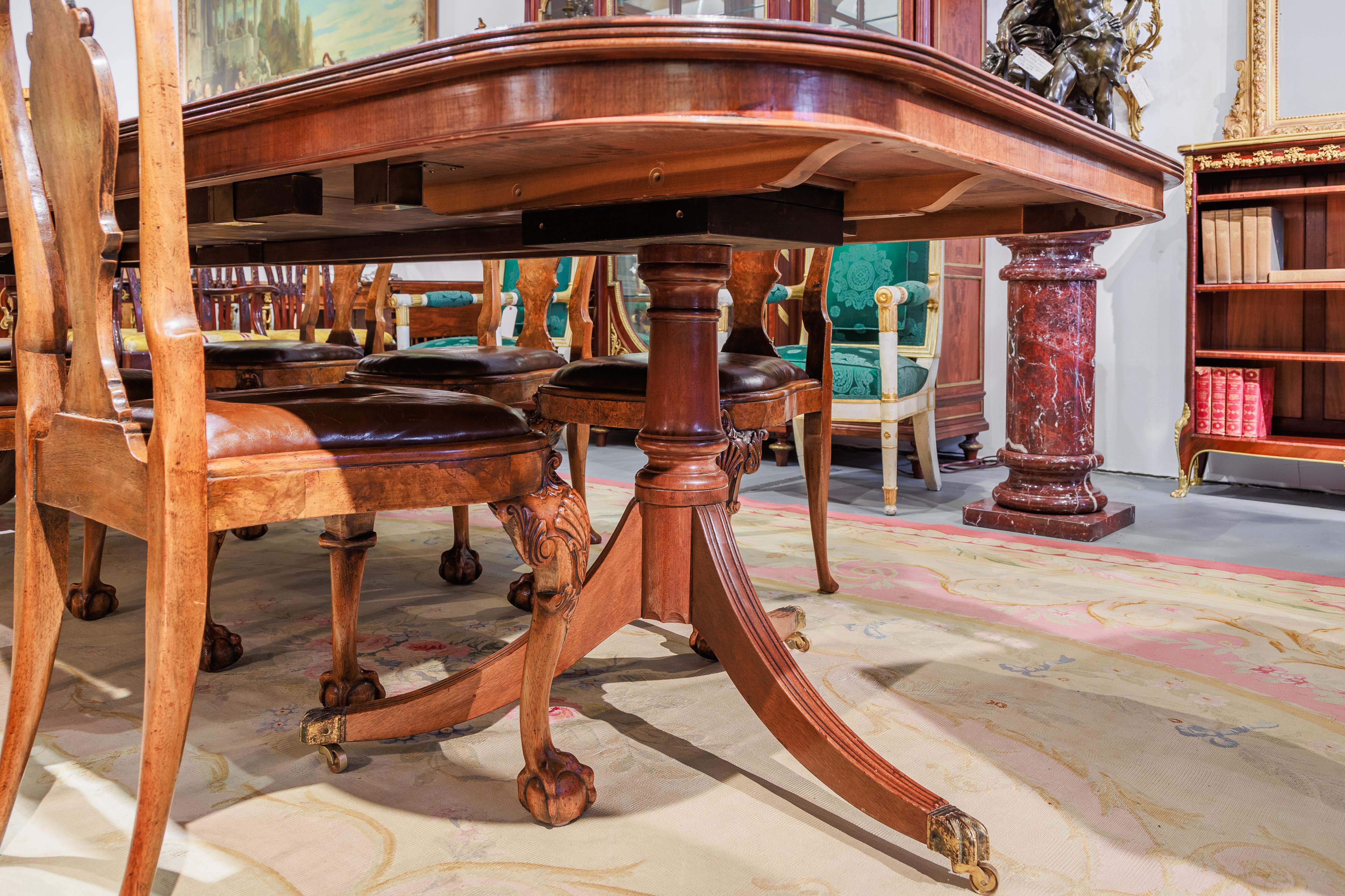 A fine late 19th c Queen Anne style burled Walnut dining table and 8 chairs 1