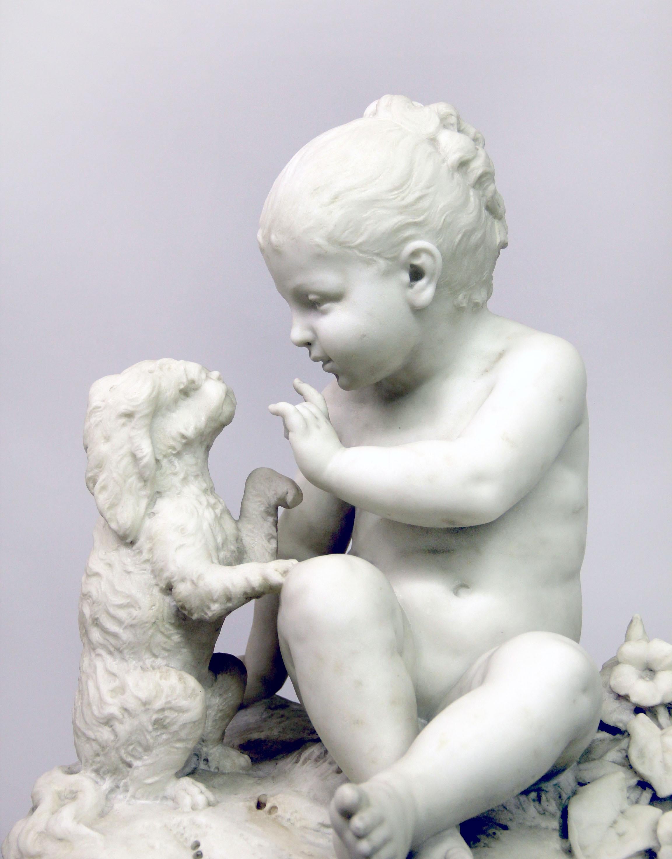 A fine late 19th century Italian white Carrara marble of a child and dog

A young child sitting and training their dog, on top of a rouge marble base.