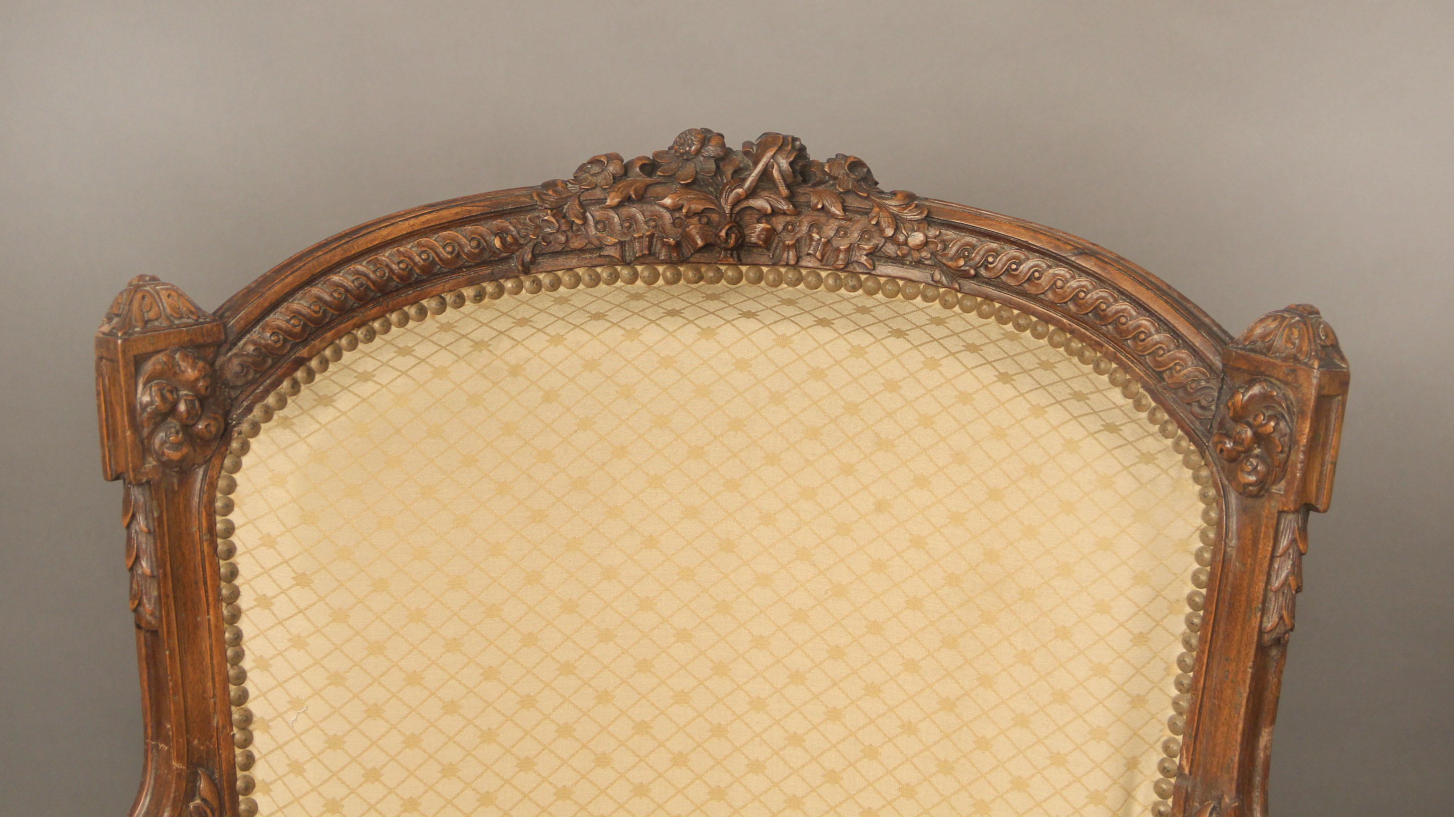 A fine late 19th century Louis XV style carved wood bergère

High back and wide seat with hand carved floral designed frame.