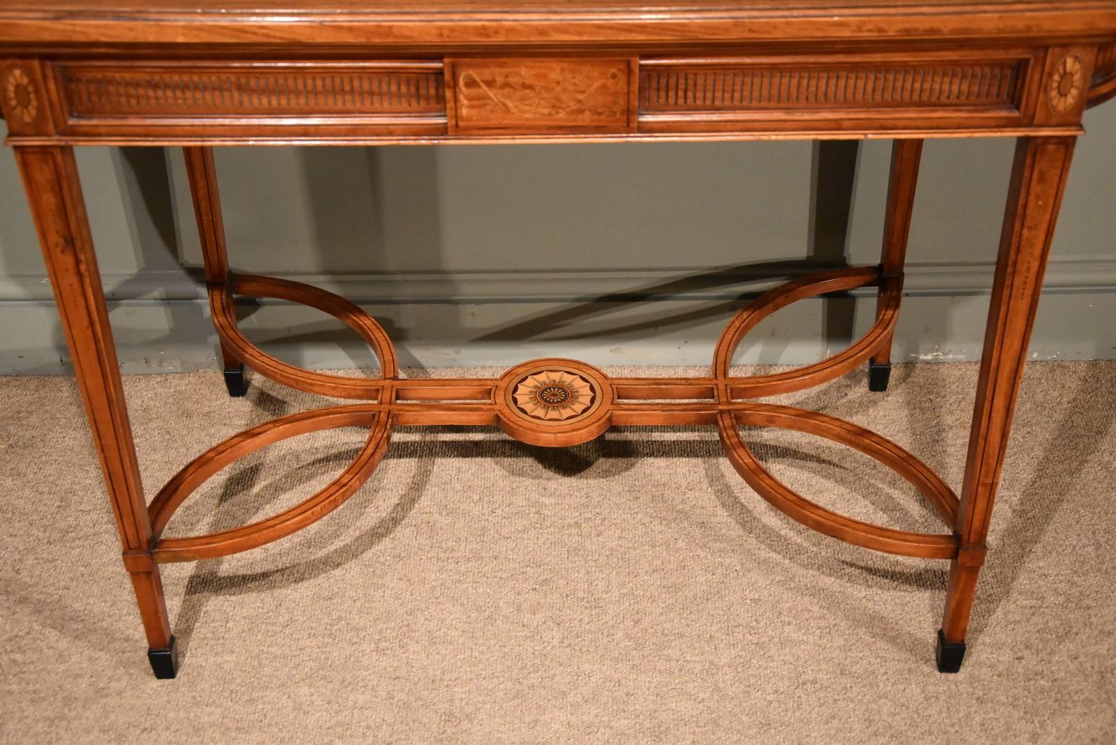 A fine late 19th century satinwood inlaid writing table. Probably by 
