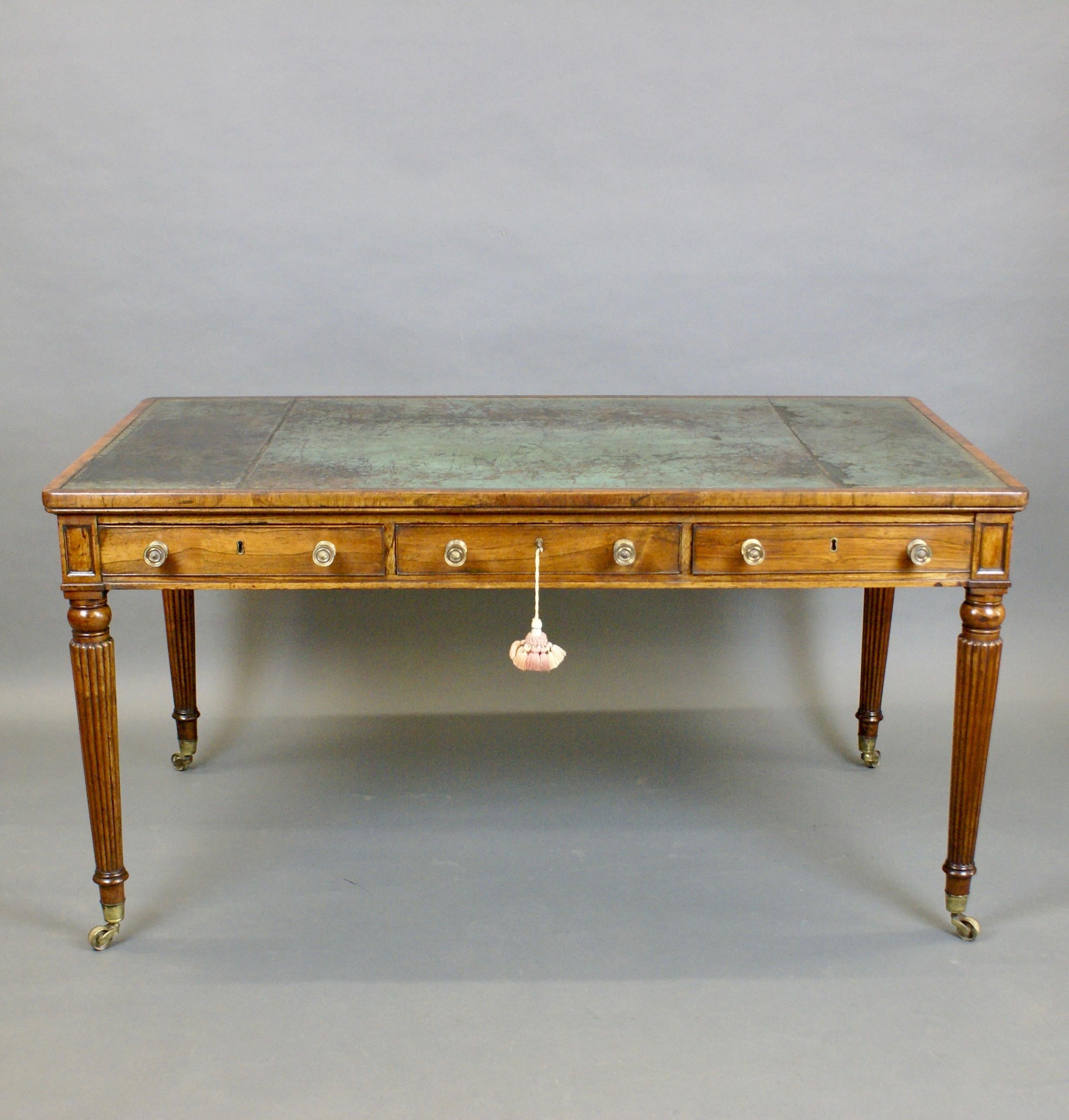 A fine late George III period rosewood writing/ library table by Solomon & Brown, Castle St. Long Acre London . The cross- banded edge enclosing a distressed marble blue hide inset, which appears to be the original.
Comprising three drawers and