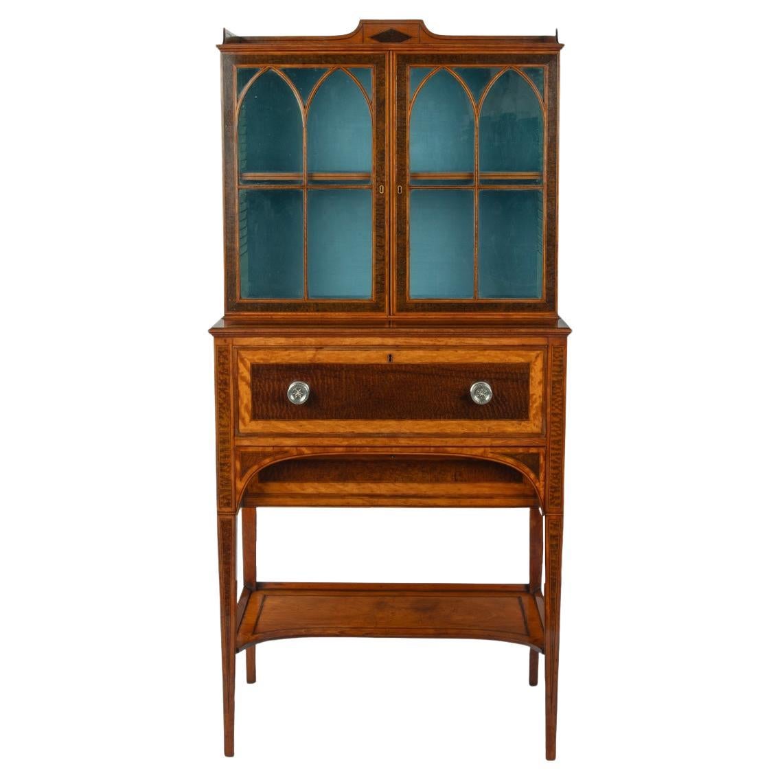A fine late George III satinwood and snakewood secretaire cabinet