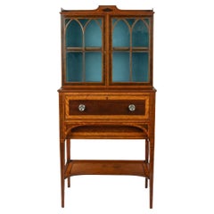 A fine late George III satinwood and snakewood secretaire cabinet