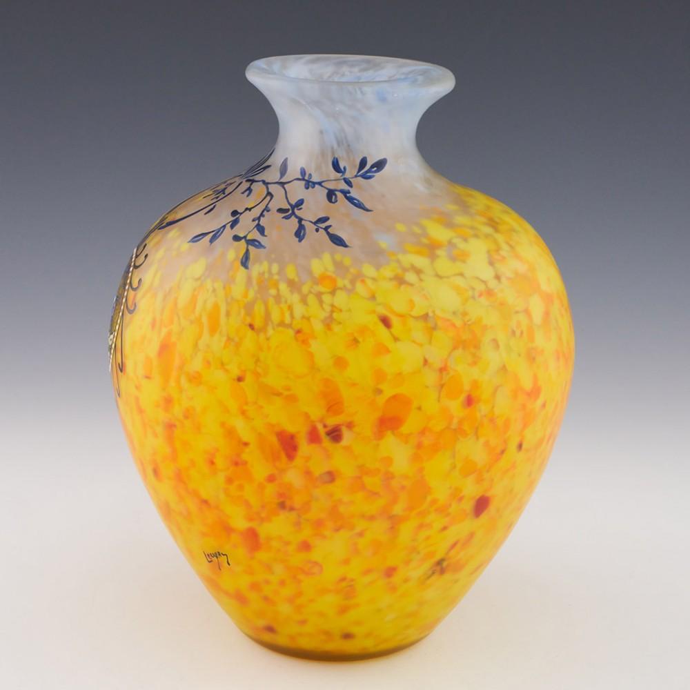 A fine Legras enamelled cameo vase from c1925 made in St Denis, Paris, France.
The bowl features mottled powder blue transitioning to yellow and orange shades encased in clear glass. Blue enamelled leaves suspending a beaded medallion with running