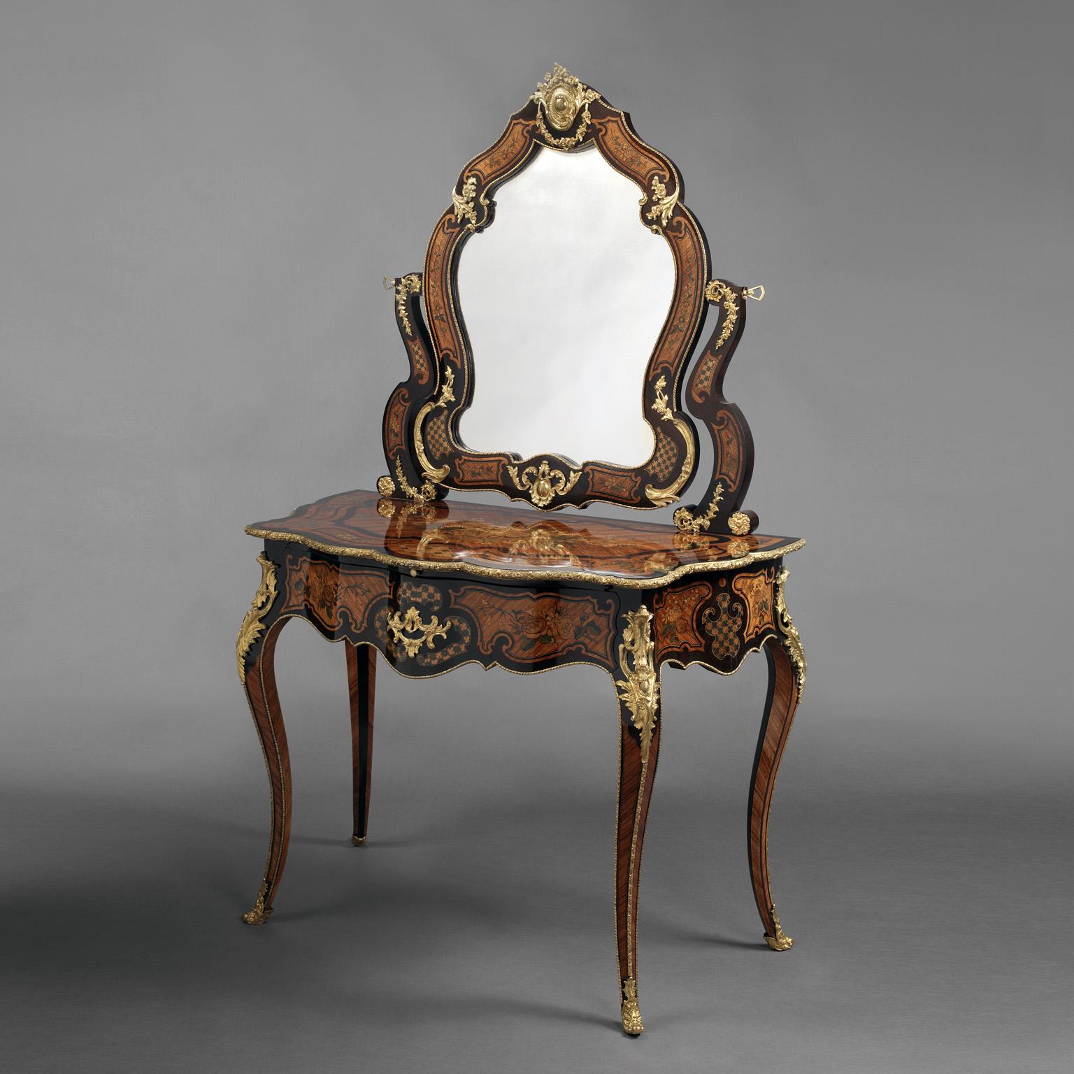 A fine Louis XV style gilt-bronze mounted marquetry inlaid dressing table by Maison Giroux. 

The underside of the drawer with a stencil mark and paper label for 'Alphonse Giroux & Cie'. 

This rare dressing table is inlaid all over with very
