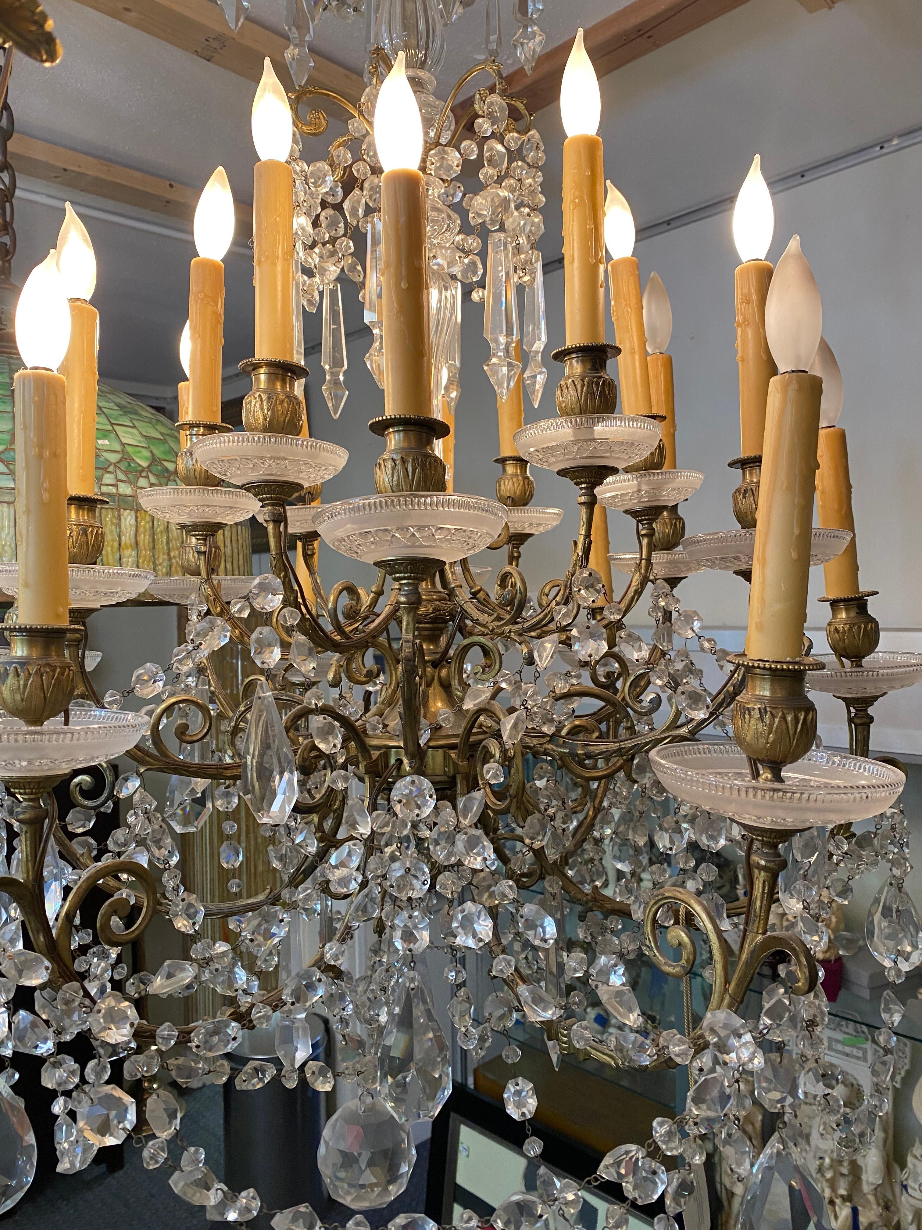 A fine Louis XV style gilt-bronze and cut crystal 18-light chandelier, late
19th century
Measures: Height 48 in. (121.92 cm.),
Width 32 in. (81.28 cm.)